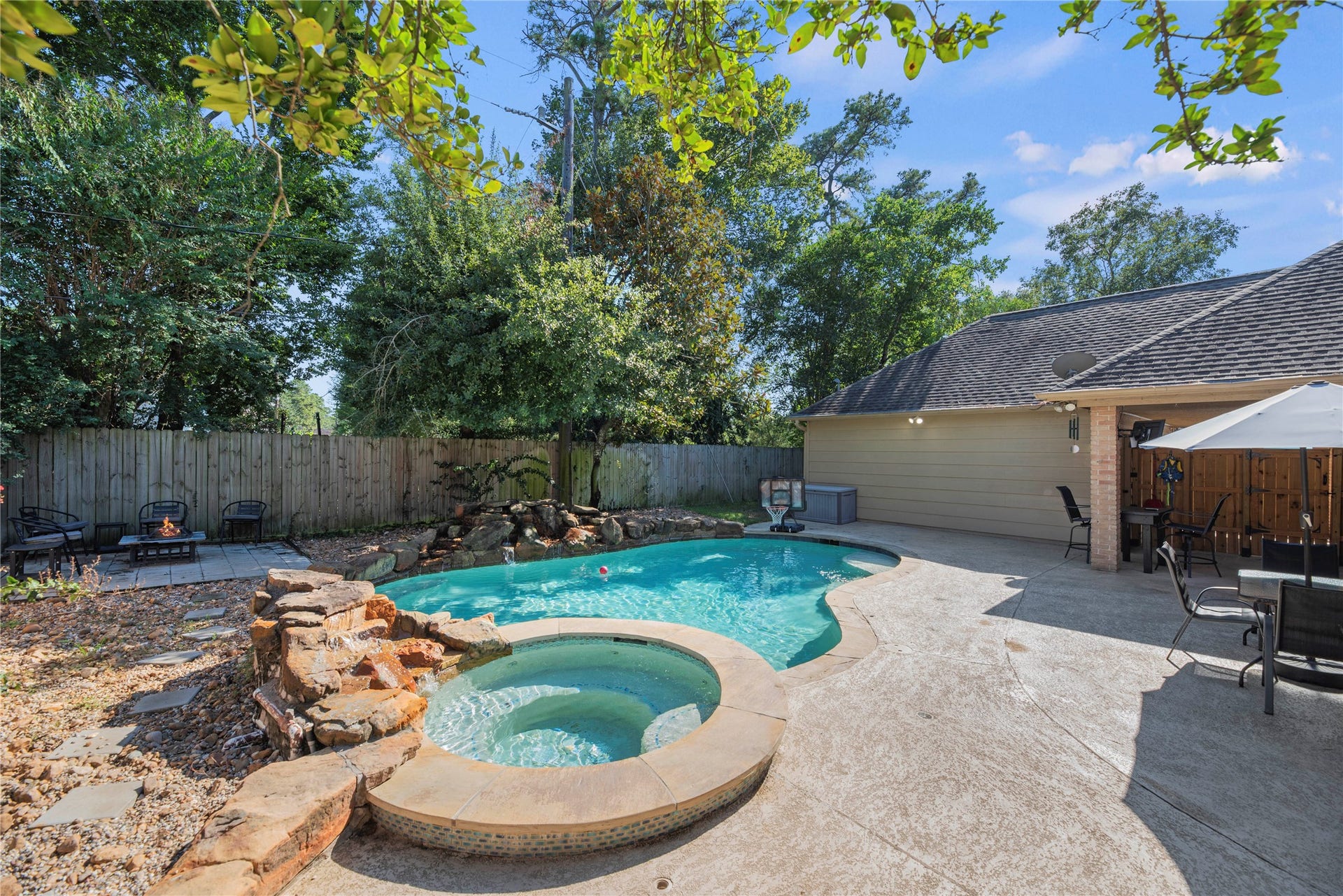 5823 Ashmere Lane, Spring, TX 77379 A little relaxation goes a long way. Slip into the bubbling spa, enjoy a refreshing swim or gather with friends around the pool. With plenty of deck to lounge and entertain, this backyard is ready for everything from quiet afternoons to lively weekends with friends and family.