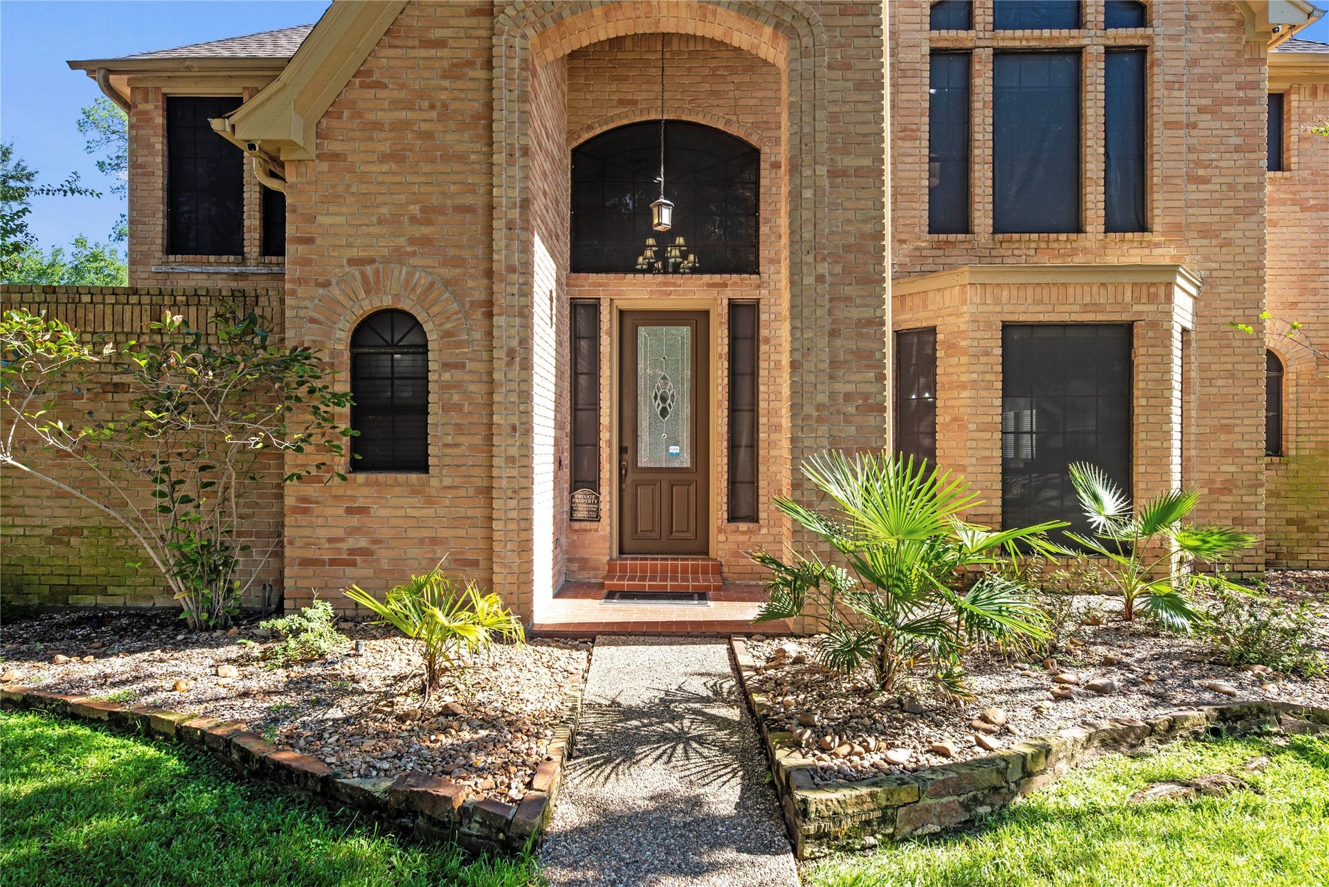 5823 Ashmere Lane, Spring, TX 77379 This home's impressive two story brick entry makes a beautiful first impression with its architectural details, leaded glass front door with transoms and stylish lighting. Solar screens, a security system and a sprinkler system add practical benefits and extra peace of mind.