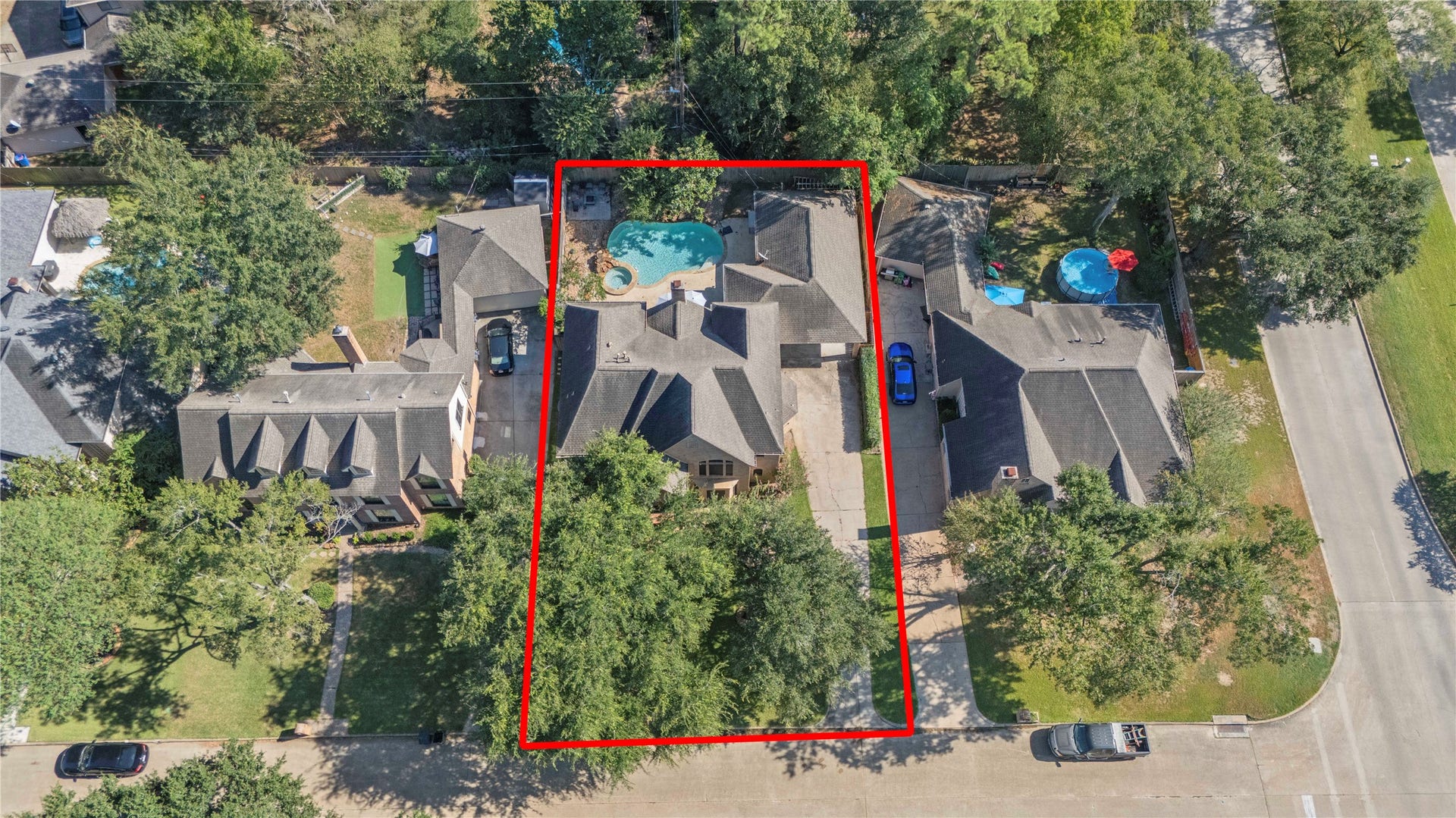 5823 Ashmere Lane, Spring, TX 77379 From above, this beautiful home and its gorgeous outdoor spaces are certainly worth a closer look! Mature trees add shade and character, while the long driveway offers plenty of parking. And with a backyard pool and spa just steps from the house, there's even more to love once you arrive.