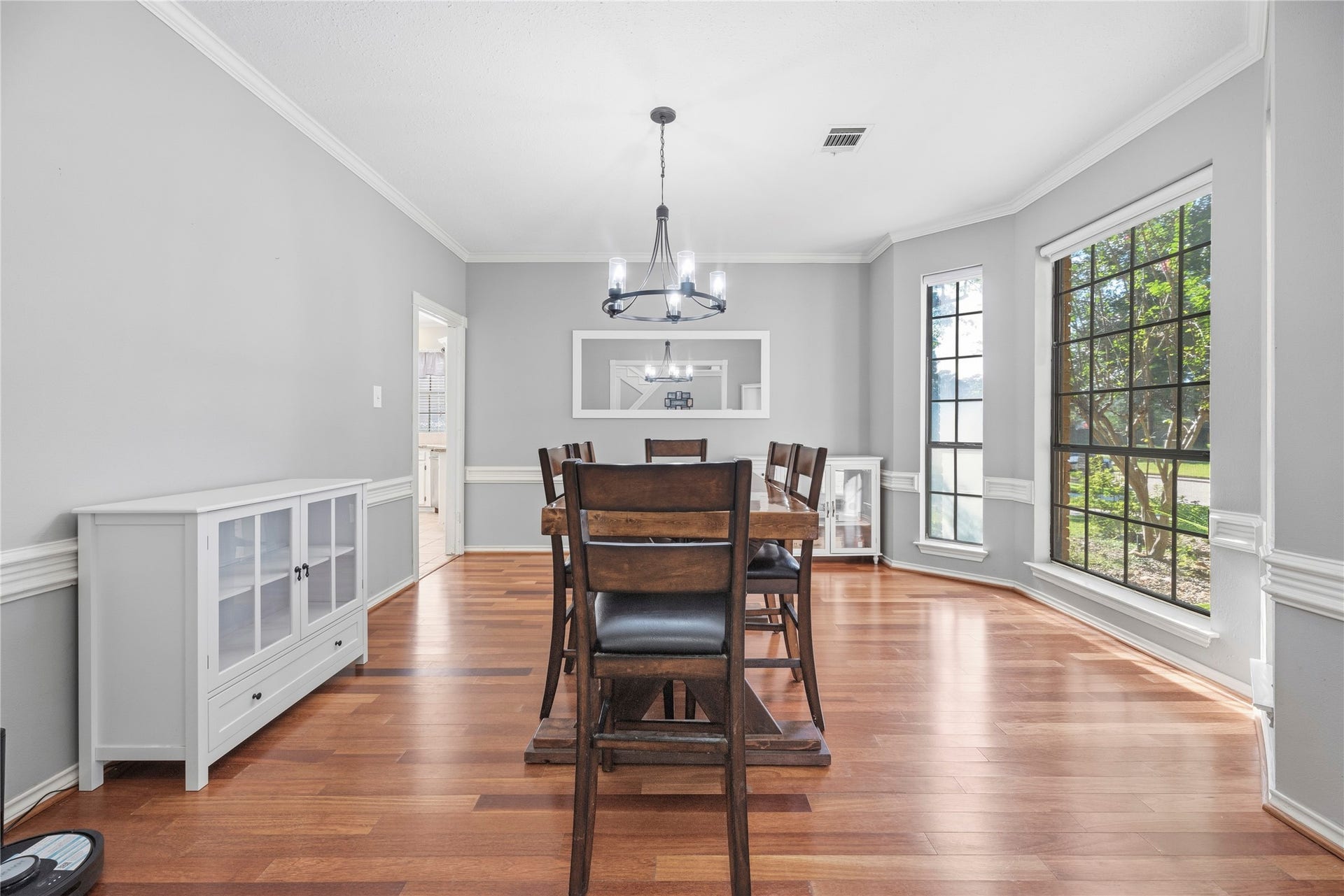5823 Ashmere Lane, Spring, TX 77379 Beautiful wood flooring, rich millwork and an elegant chandelier set the stage for your next special occasion, whether its Wednesday night lasagna or a favorite birthday dinner.