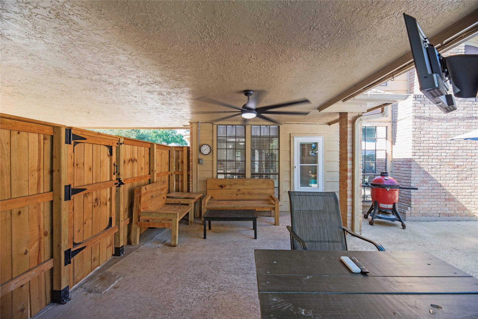 5823 Ashmere Lane, Spring, TX 77379 This spacious covered patio feels like an extension of the home, with room to spread out and enjoy the backyard in comfort. A ceiling fan helps keep the air moving, while the outdoor TV makes this a great spot to catch the big game without missing out on the poolside fun.