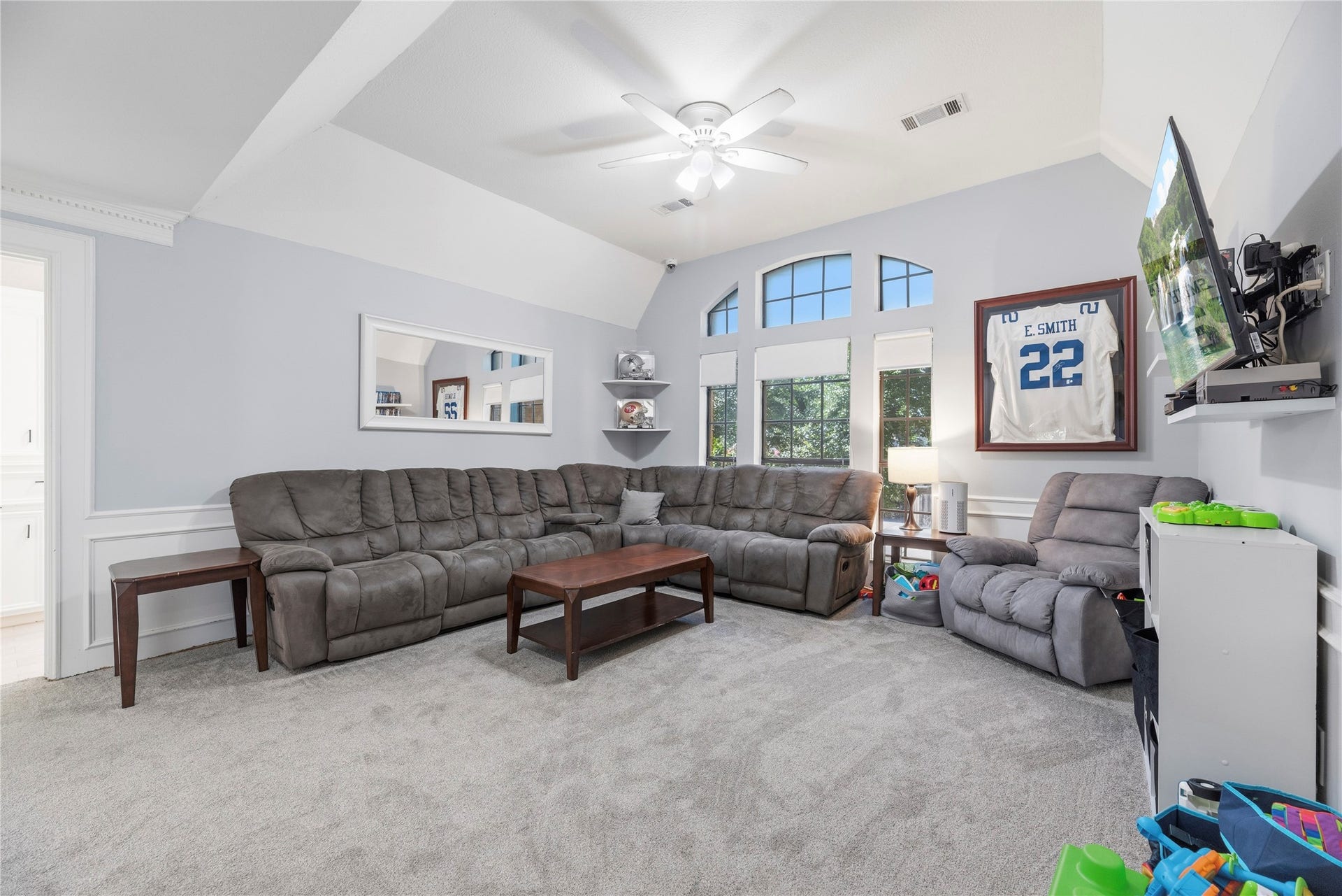 5823 Ashmere Lane, Spring, TX 77379 The upstairs game room offers plenty of space to stretch out, relax and get a little messy. A vaulted ceiling with a cooling fan and arched windows creates a bright, inviting space that's perfect for everything from Saturday morning cartoons to Sunday night football.
