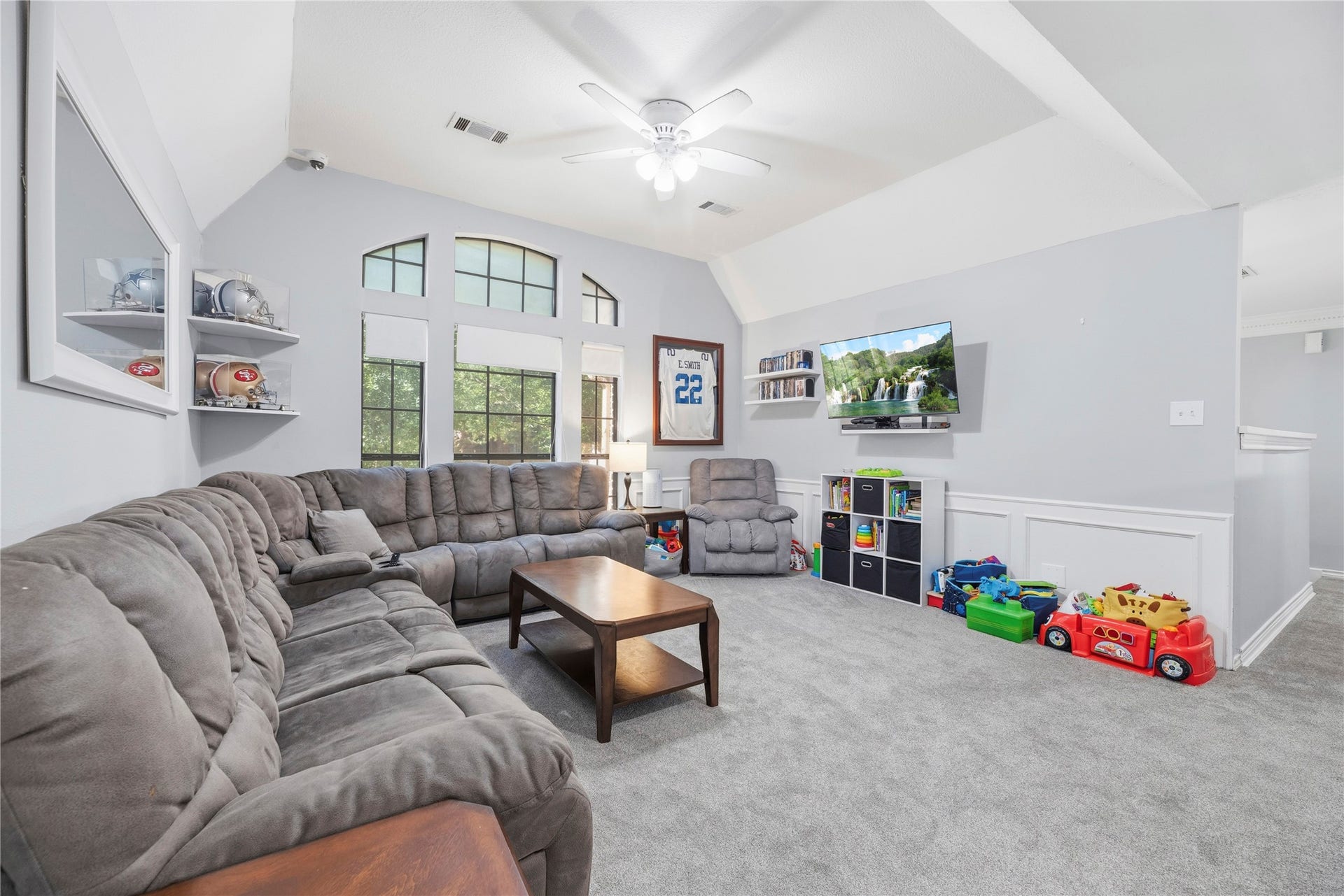 5823 Ashmere Lane, Spring, TX 77379 There's plenty of room for fun in this spacious upstairs game room with a vaulted ceiling, updated carpet, and a wall of windows that fills the space with natural light. Whether it's movie nights, watching the big game or spending time with friends, this comfortable gathering space has room for everyone.