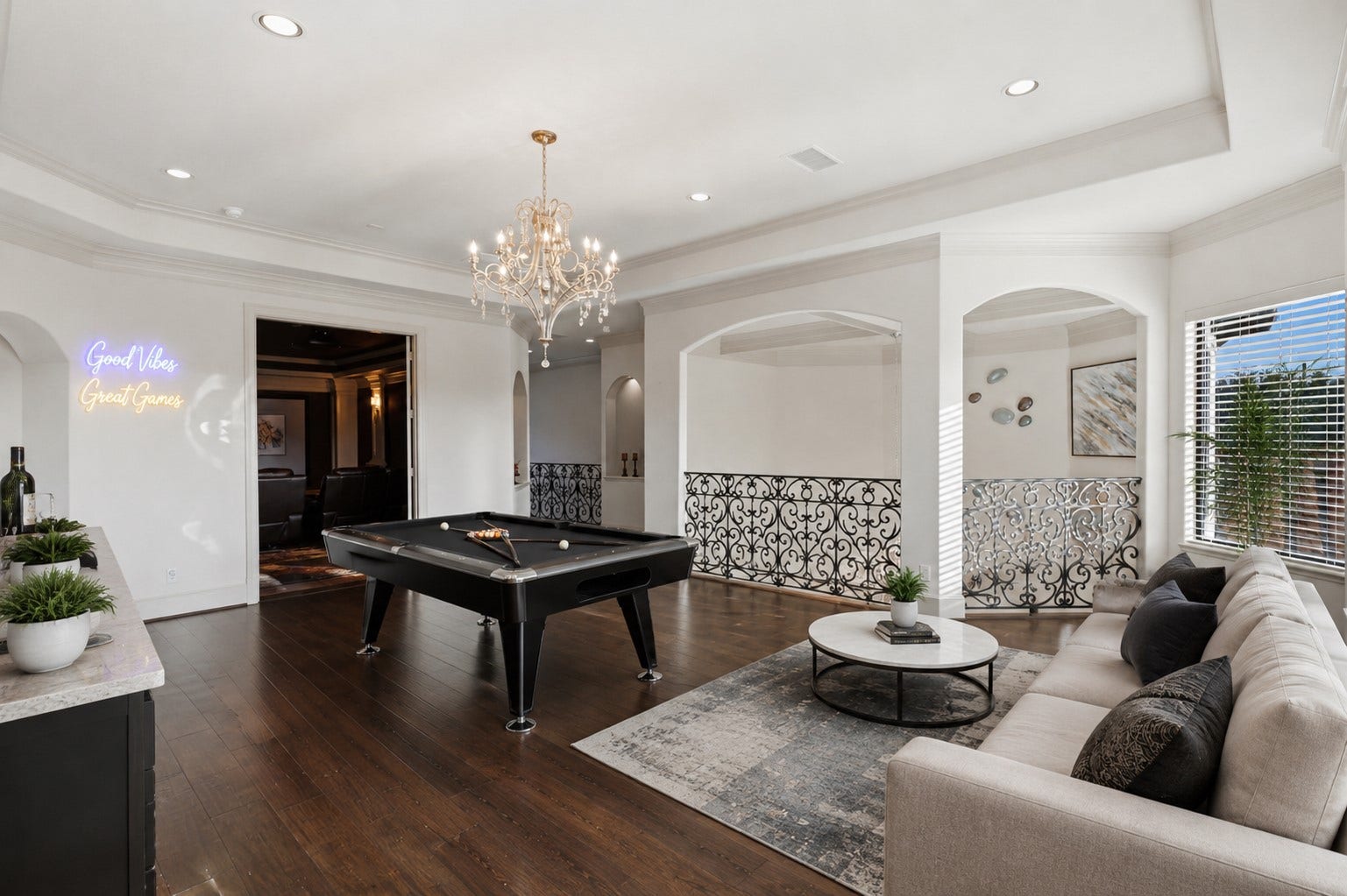 Spacious upstairs game room with a double-wide doorway leading to the adjacent media room..**Virtually staged