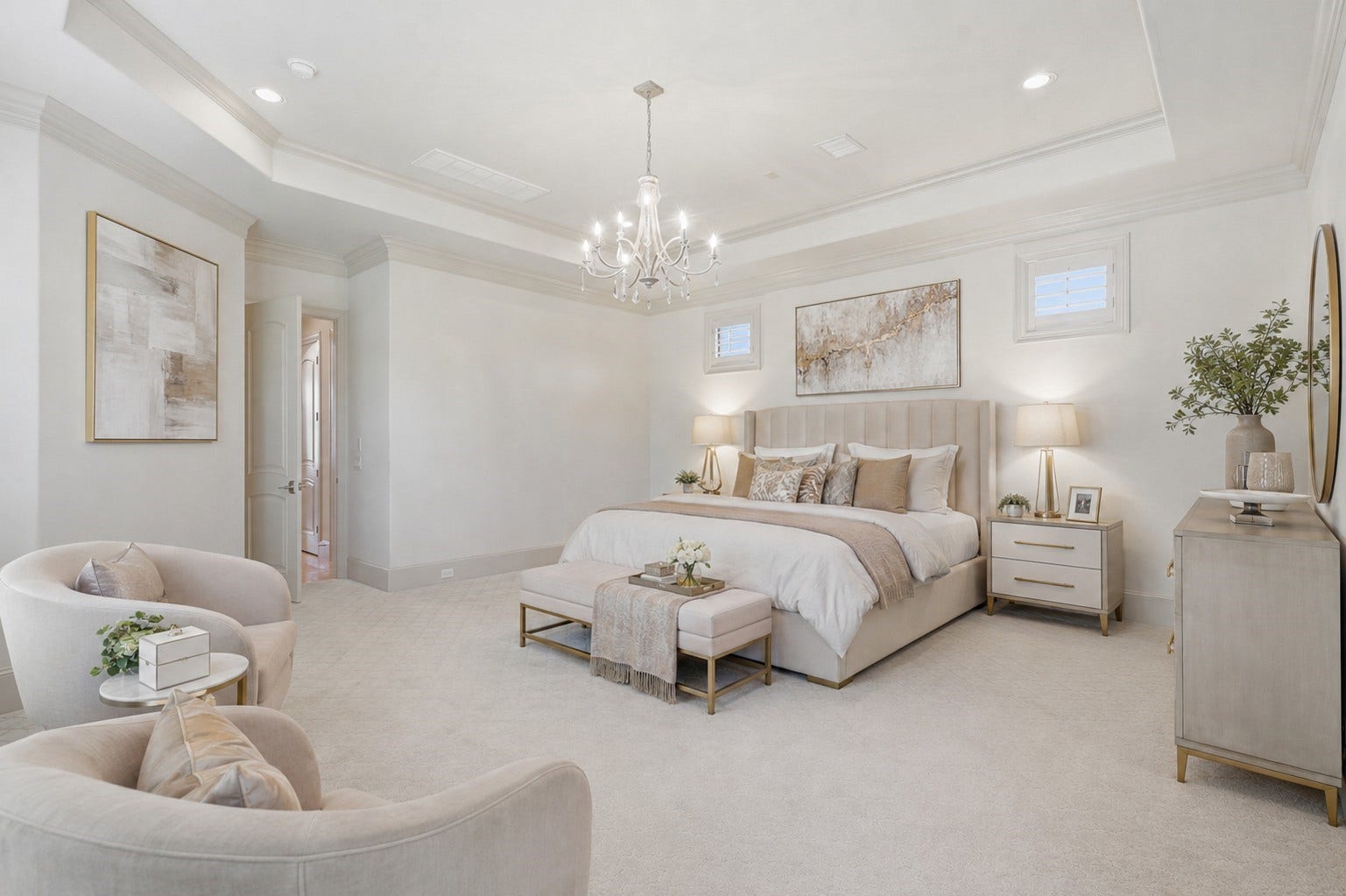 The primary bedroom suite exhibits an octagonal tray ceiling, multi-tier crown molding, soft carpet flooring, and recessed illumination.