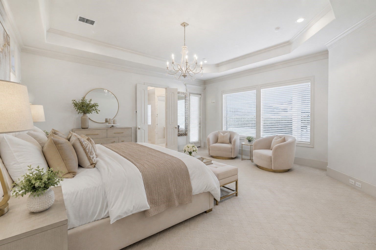 Generous picture windows with plantation blinds brighten the bedroom layoutideal for a reading or sitting nookaccented by a double-door passage, deep baseboards, and detailed trim.