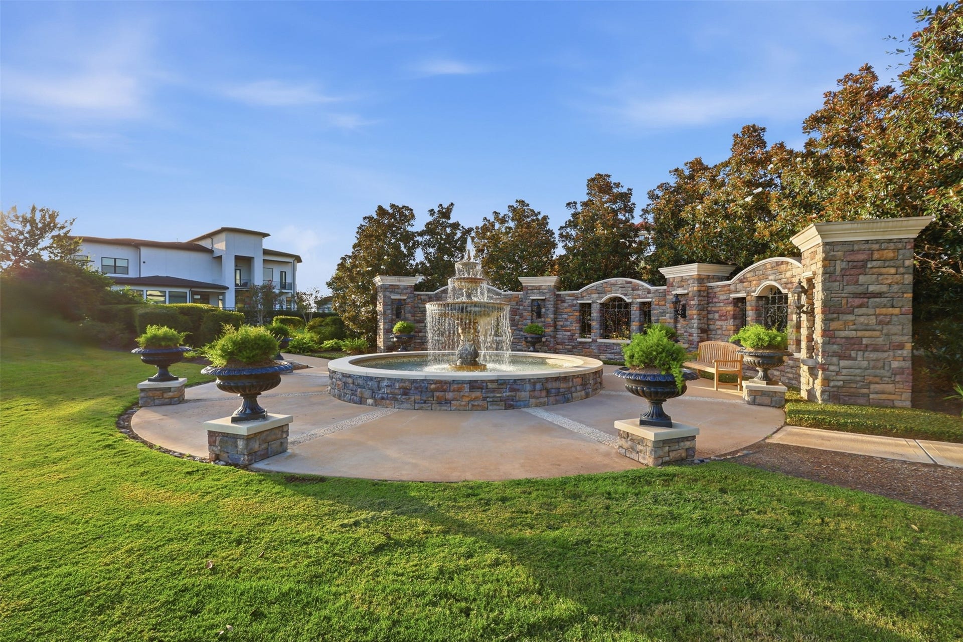 Community courtyard with a multi-tier fountain, offering a peaceful gathering space just moments from home.