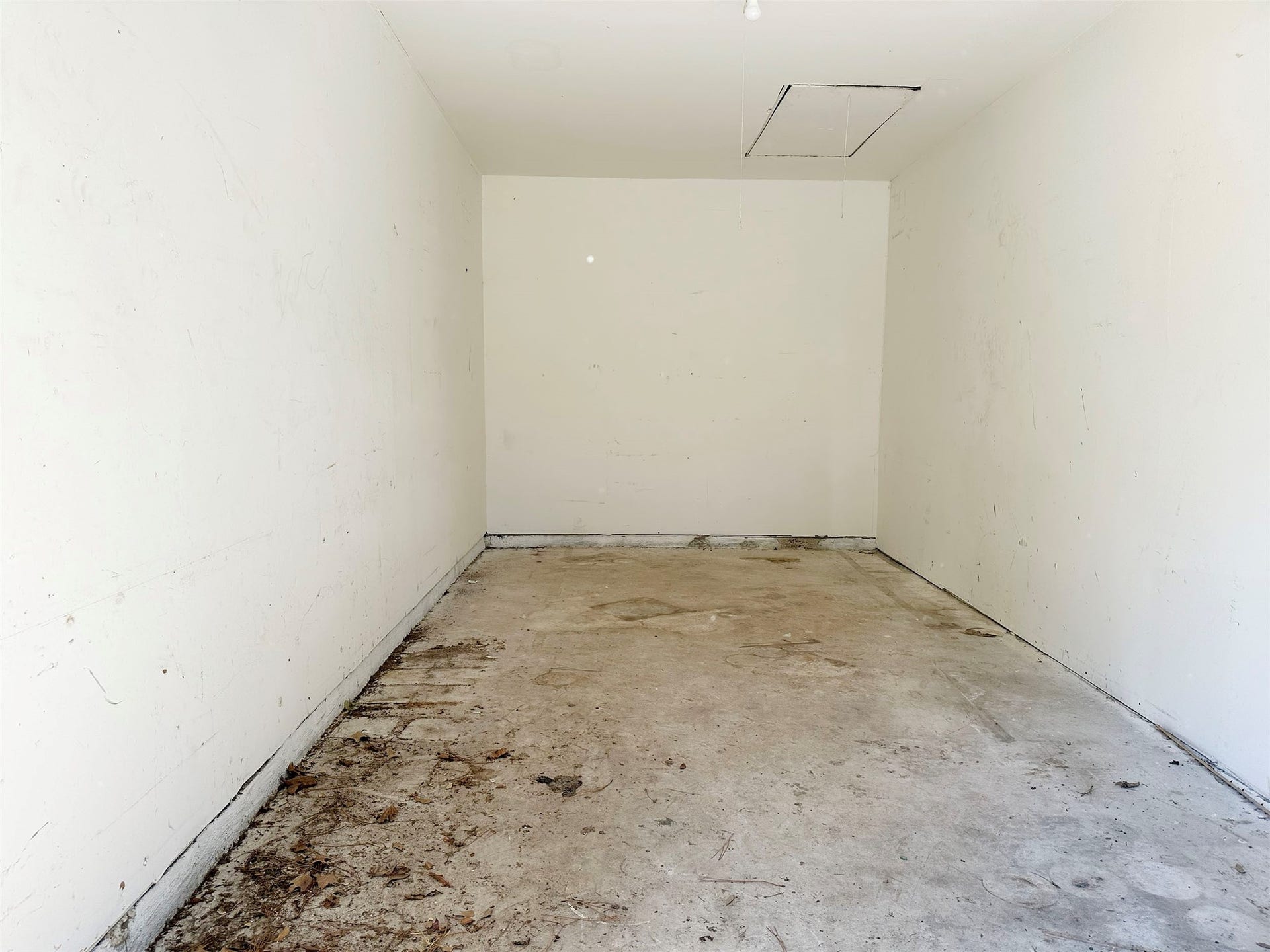 The two car garage currently has a wall added down the middle that can be removed by the new owner.