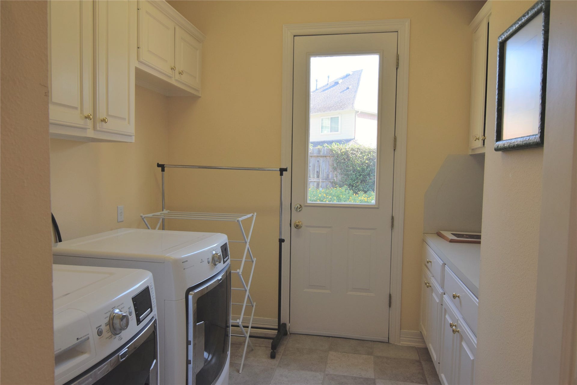 3010 Acorn Wood Way, Houston, TX 77059 Laundry with Cabinet Storage and Folding Counter