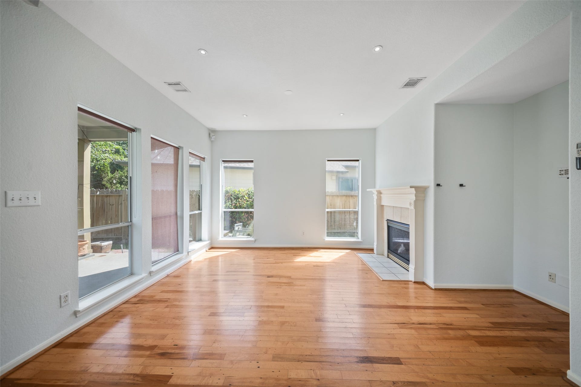 main living area equipped with high ceilings and fireplace