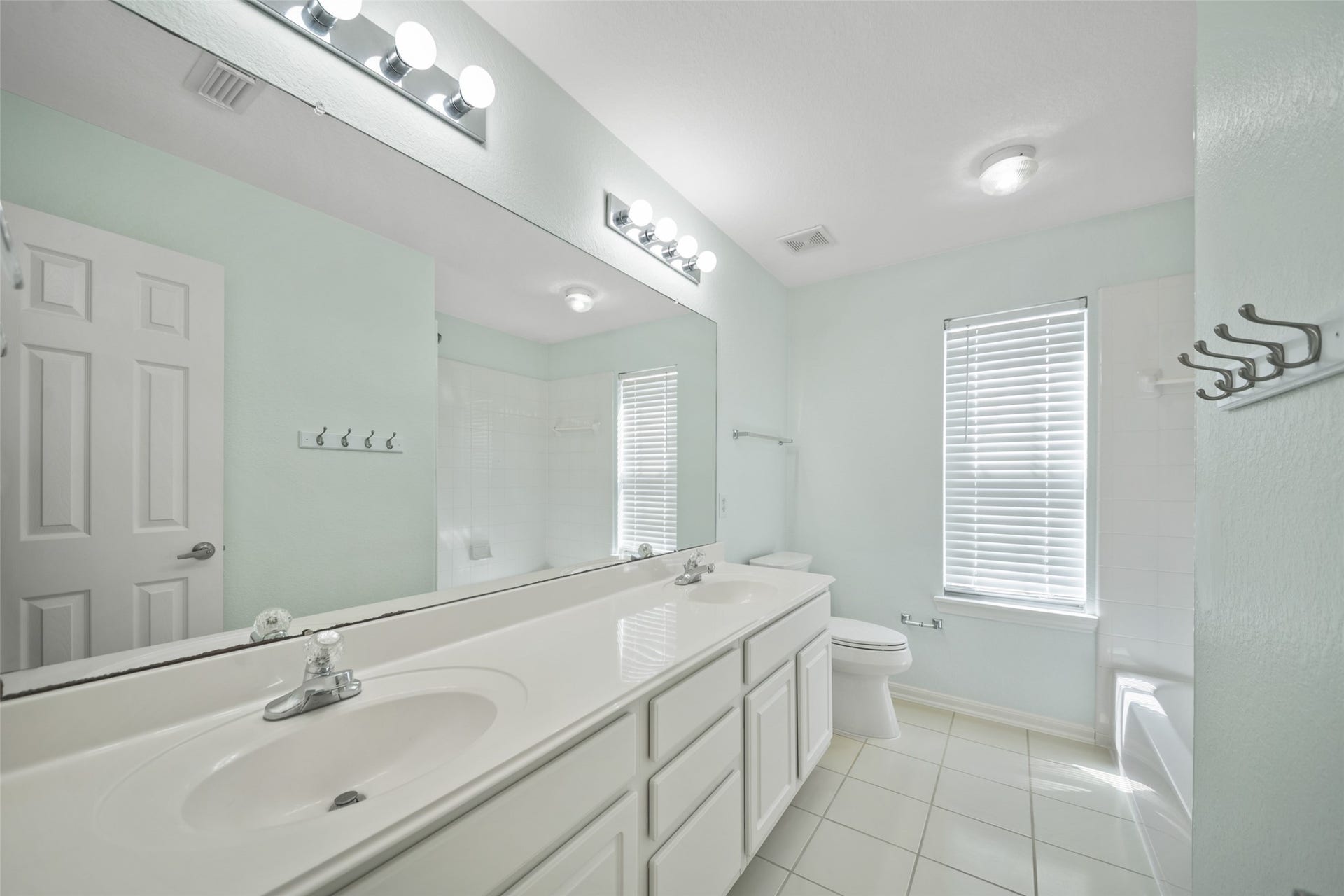 secondary full bathroom upstairs. double sinks and shower bath combo