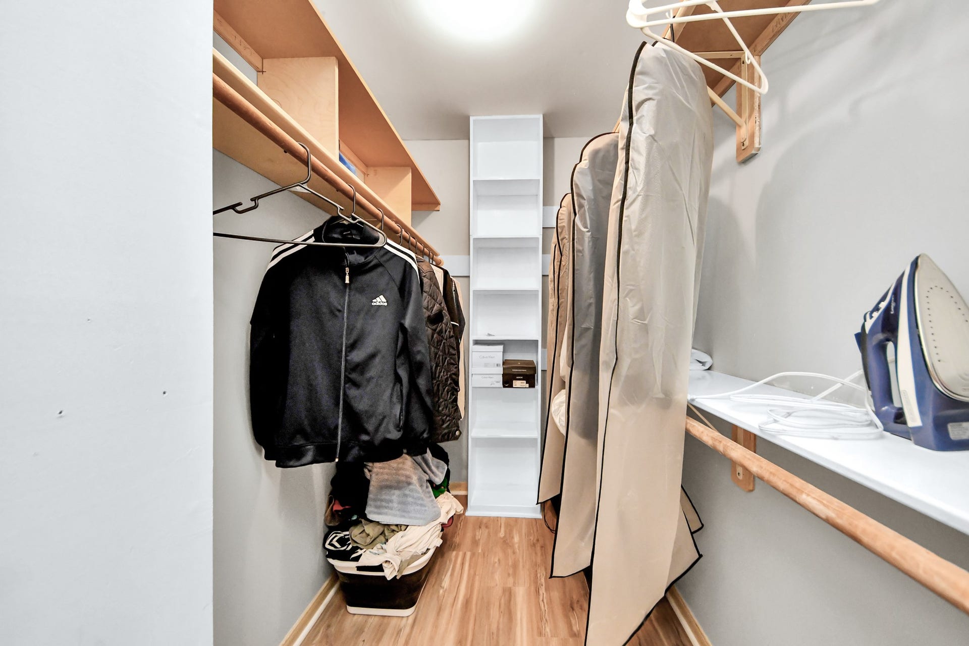 2903 Blue Glen Lane, Houston, TX 77073 This full-entry closet features a comprehensive network of built-in shelving and integrated hanging rods to maximize storage efficiency.