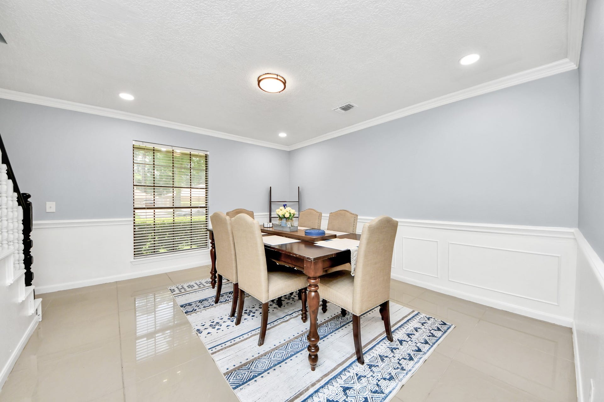 2903 Blue Glen Lane, Houston, TX 77073 Intricate wainscoting and crown molding frame this elegant dining space, wrapped in a light palette that elevates every dinner party.