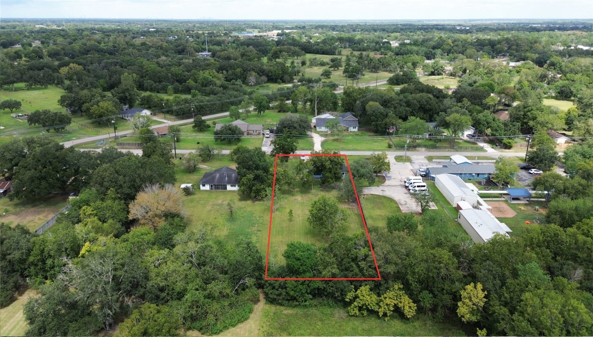 2605 W Dumble Street, Alvin, TX 77511 Discover a spacious lot embraced by lush greenery, offering privacy and a serene setting for your dream home, all while enjoying the tranquility of a rural neighborhood with convenient access to nearby amenities.