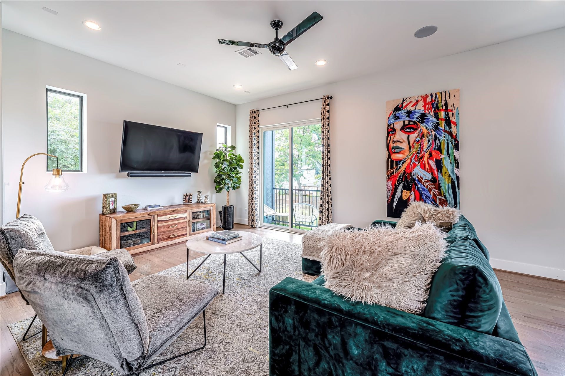 Ideal layout for entertaining with seamless flow between the living area, dining space, and kitchen.Photos reflect previous furnishings. Home is currently vacant. Furnishings shown are for illustrative purposes only.
