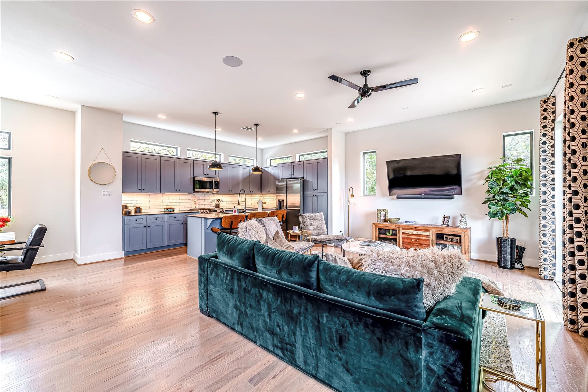 Ideal layout for entertaining with seamless flow between the living area, dining space, and kitchen. Photos reflect previous furnishings. Home is currently vacant. Furnishings shown are for illustrative purposes only.