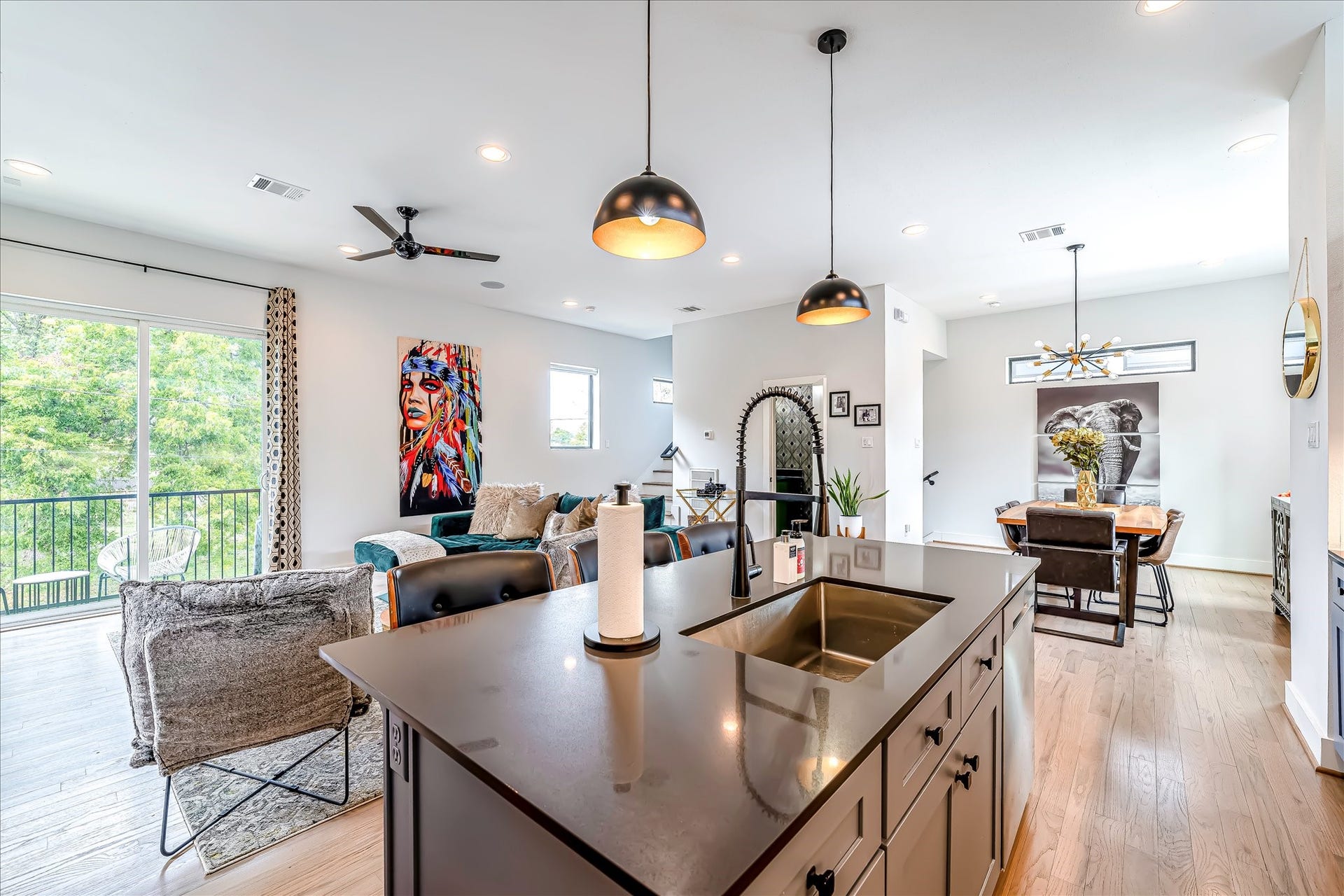 Large island creates the perfect gathering space for family, entertaining, and everyday living. Photos reflect previous furnishings. Home is currently vacant. Furnishings shown are for illustrative purposes only.