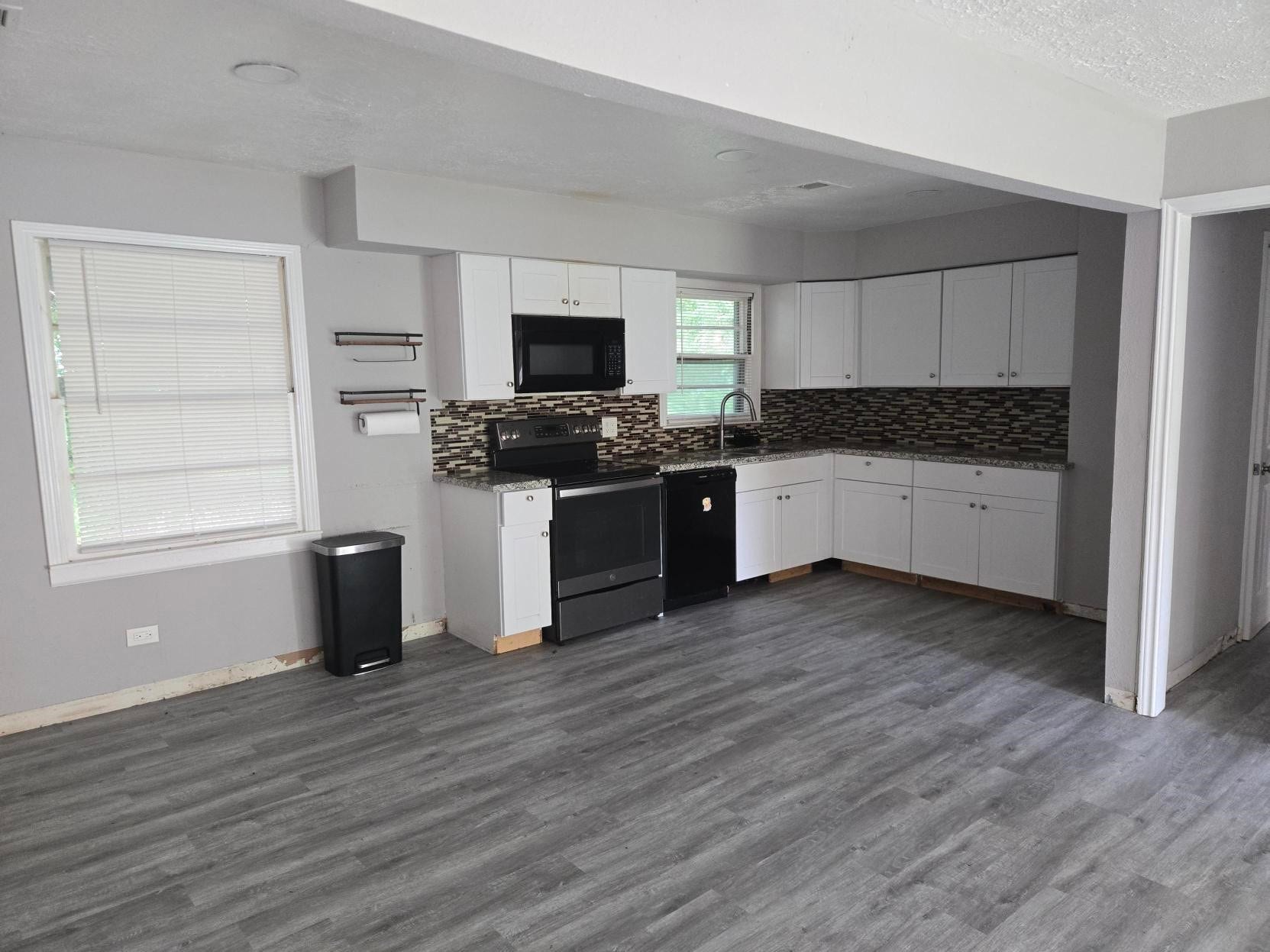 4611 Nevada, Dickinson, TX 77539 A modern kitchen with, cabinets, appliances, and a laminate floor.