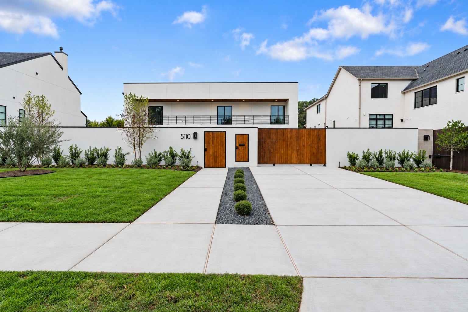 5110 Glenmeadow Drive, Houston, TX 77096 Sleek, sophisticated, and completely private, this modern stucco estate sits behind elegant walls and a gated entry, with a covered front balcony overlooking the approach. A discreet smart parcel gate receives every delivery securely while your sanctuary stays closed.