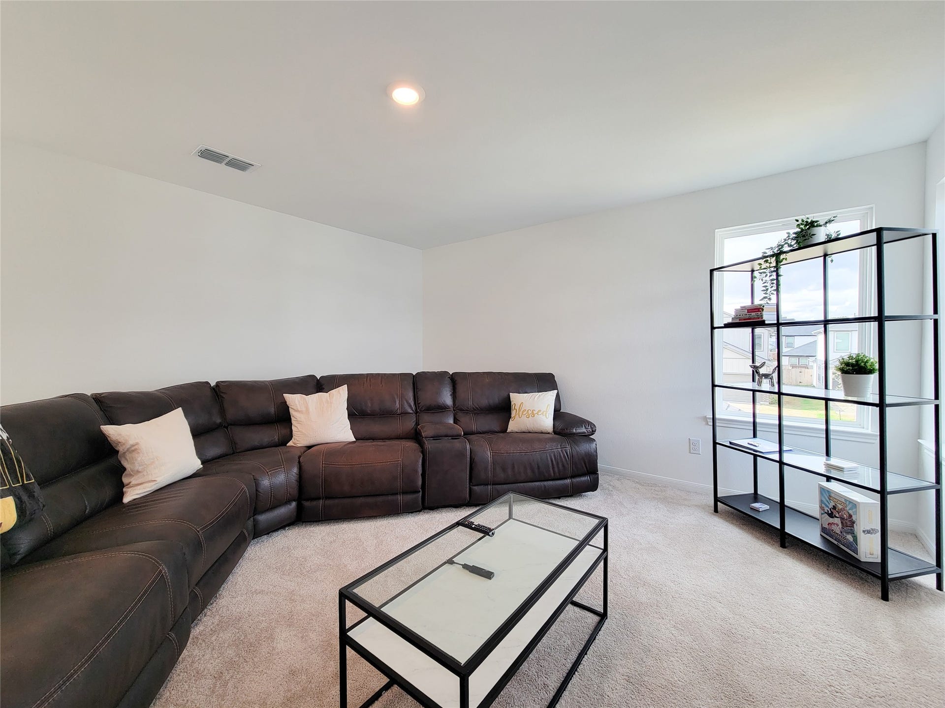 2719 Forest Retreat Lane, Missouri City, TX 77489 Spacious living room with neutral carpet and ample natural light from a window.