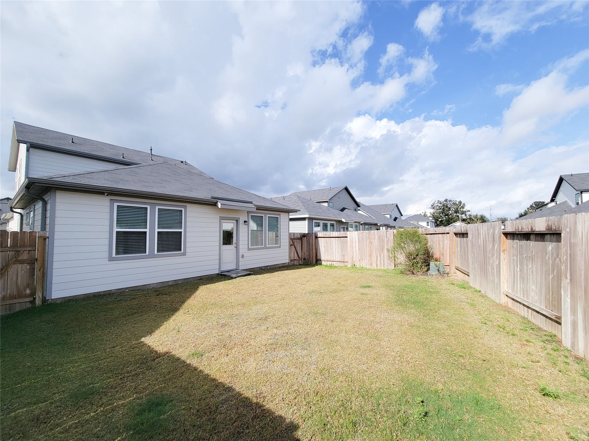2719 Forest Retreat Lane, Missouri City, TX 77489 Fenced backyard. The space is open and well-maintained, suitable for outdoor activities or gardening.