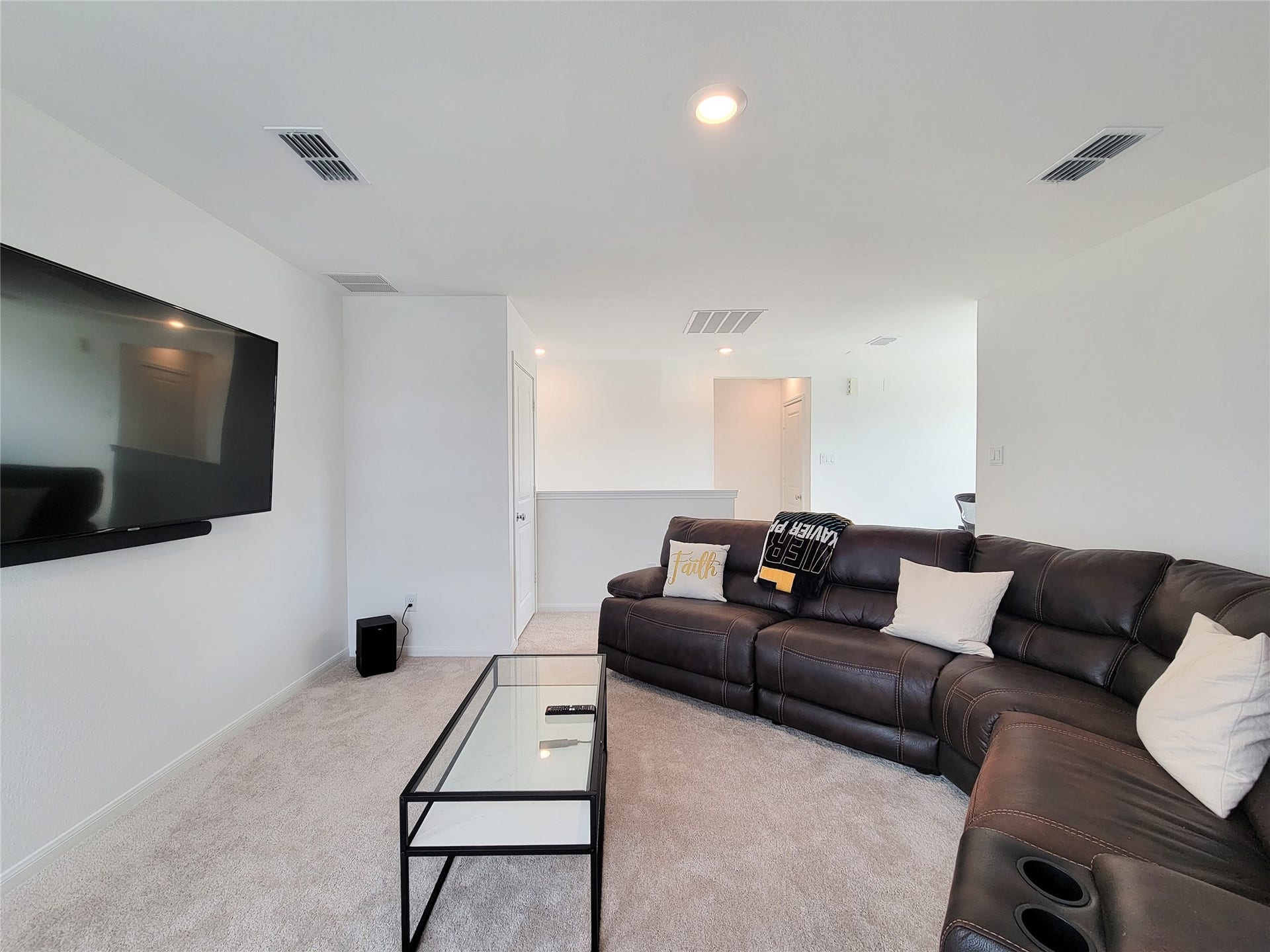 2719 Forest Retreat Lane, Missouri City, TX 77489 Spacious living area with modern features, and ample lighting. Ideal for relaxing and entertaining.