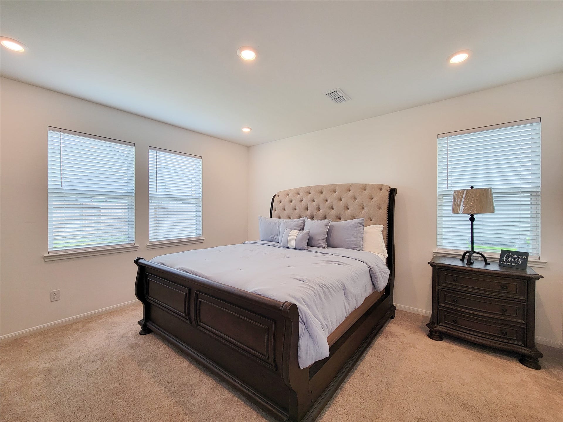 2719 Forest Retreat Lane, Missouri City, TX 77489 This spacious Primary bedroom features a large room. Ample natural light streams in through three windows.