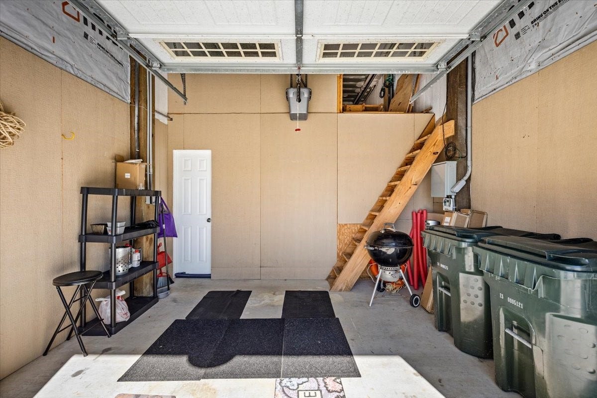 3728 Sabrina, Galveston, TX 77554 Garage has ladder steps to floored storage space