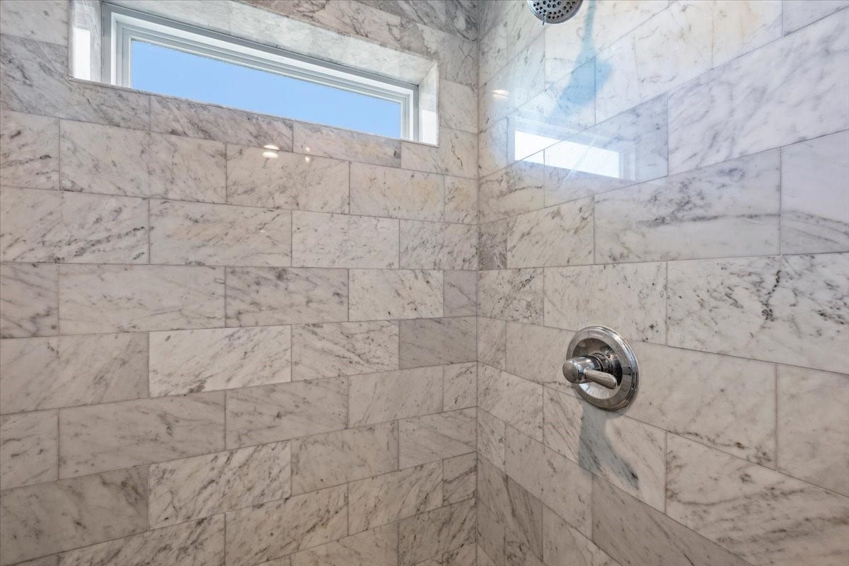 3728 Sabrina, Galveston, TX 77554 With tiled shower and window for optimal natural light