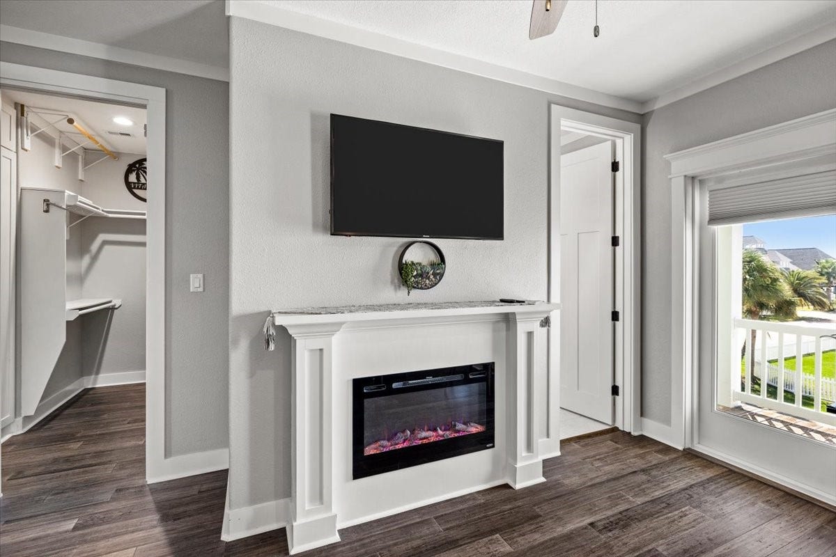 3728 Sabrina, Galveston, TX 77554 Primary bedroom with another fireplace and 2 walk-in closets