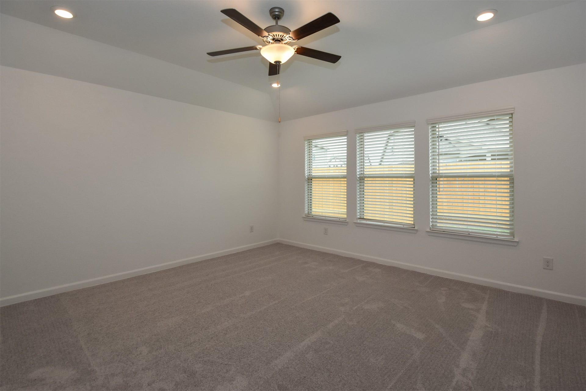 3743 Homestead Ridge Lane, Richmond, TX 77406 Huge primary bedroom with recess lighting and plenty of windows to keep an eye out on the kids