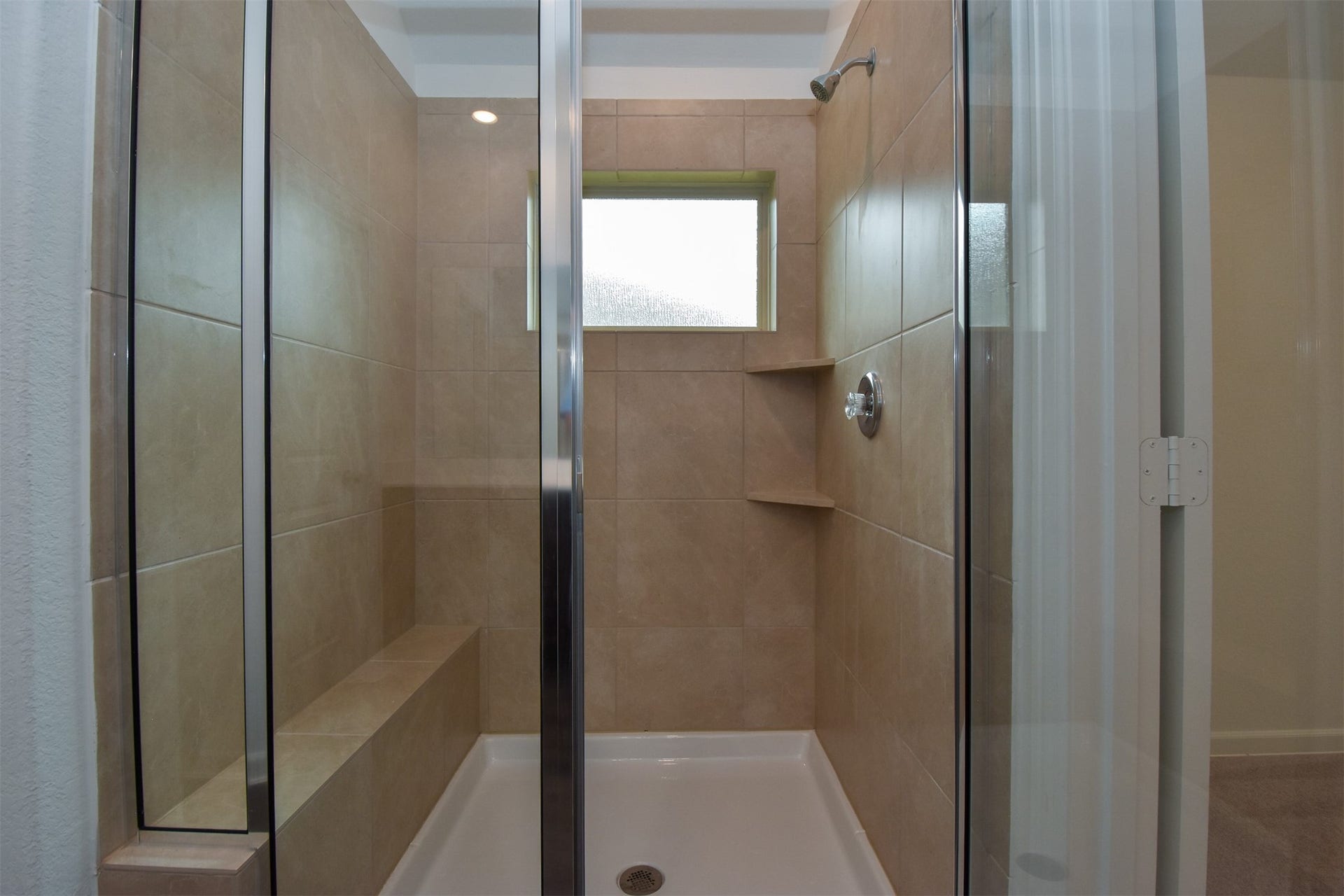 3743 Homestead Ridge Lane, Richmond, TX 77406 Large stand up shower with built in seating and shear glass door