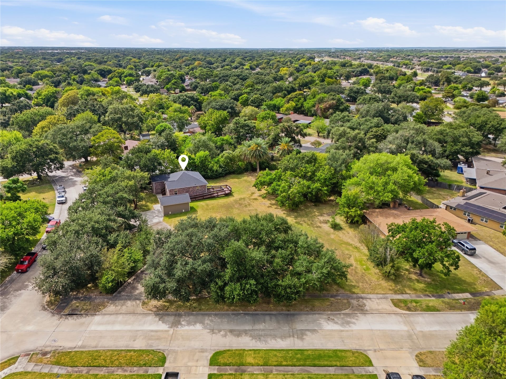 102 20th Avenue N, Texas City, TX 77590 This view shows the homes placement on the lot, with the detached garage, access ramp, and plenty of room for gardening or outdoor activities.