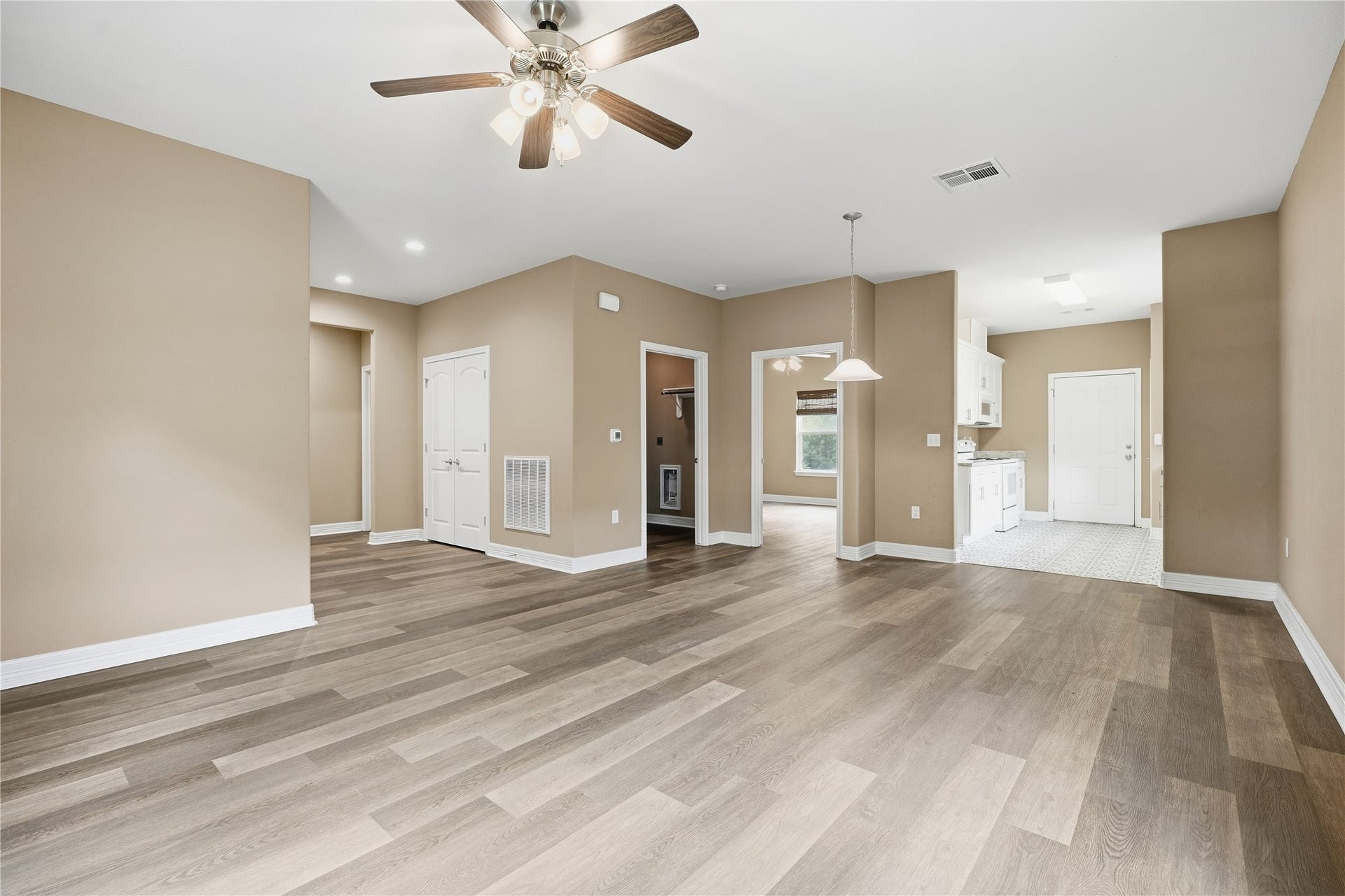 102 20th Avenue N, Texas City, TX 77590 The living room opens to the dining area and kitchen, making it easy to spend time with guests while preparing a meal.