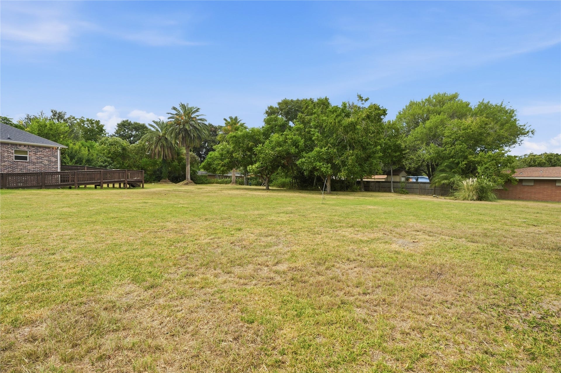 102 20th Avenue N, Texas City, TX 77590 Mature trees and palms surround the spacious yard, with room for a garden, outdoor games, or a shaded seating area.