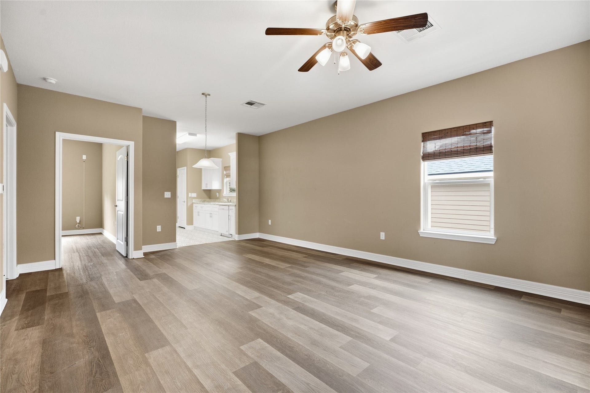 102 20th Avenue N, Texas City, TX 77590 The living room opens to the dining area and kitchen, making it easy to visit with guests while preparing a meal.