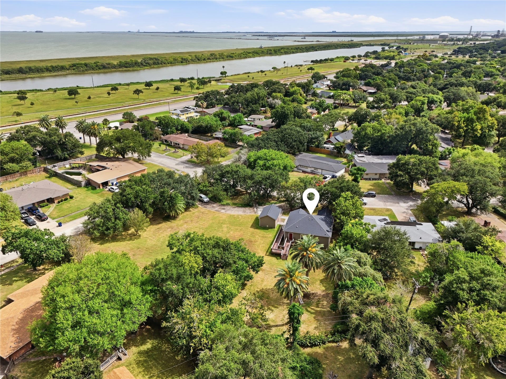 102 20th Avenue N, Texas City, TX 77590 The home sits just a few blocks from the waterfront, with nearby green space and the bay shown in this aerial view.