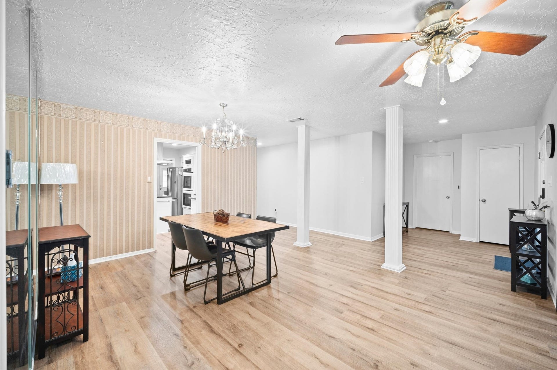 6114 Rollingbrook Drive, Houston, TX 77096 View of the dining room showcasing the enry, access to the kitchen, hallway leading to the other rooms, the foyer, entrance to the Primary bedroom & coat closet.