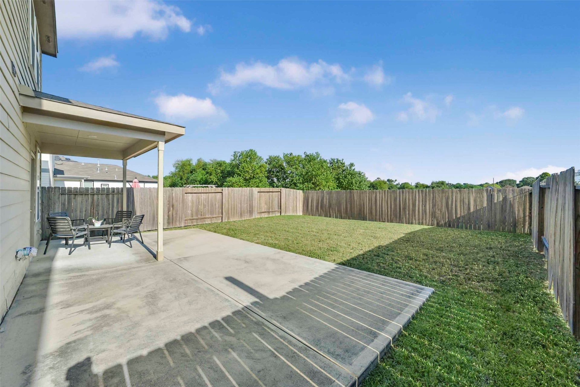 Huge extended patio and poor size yard.