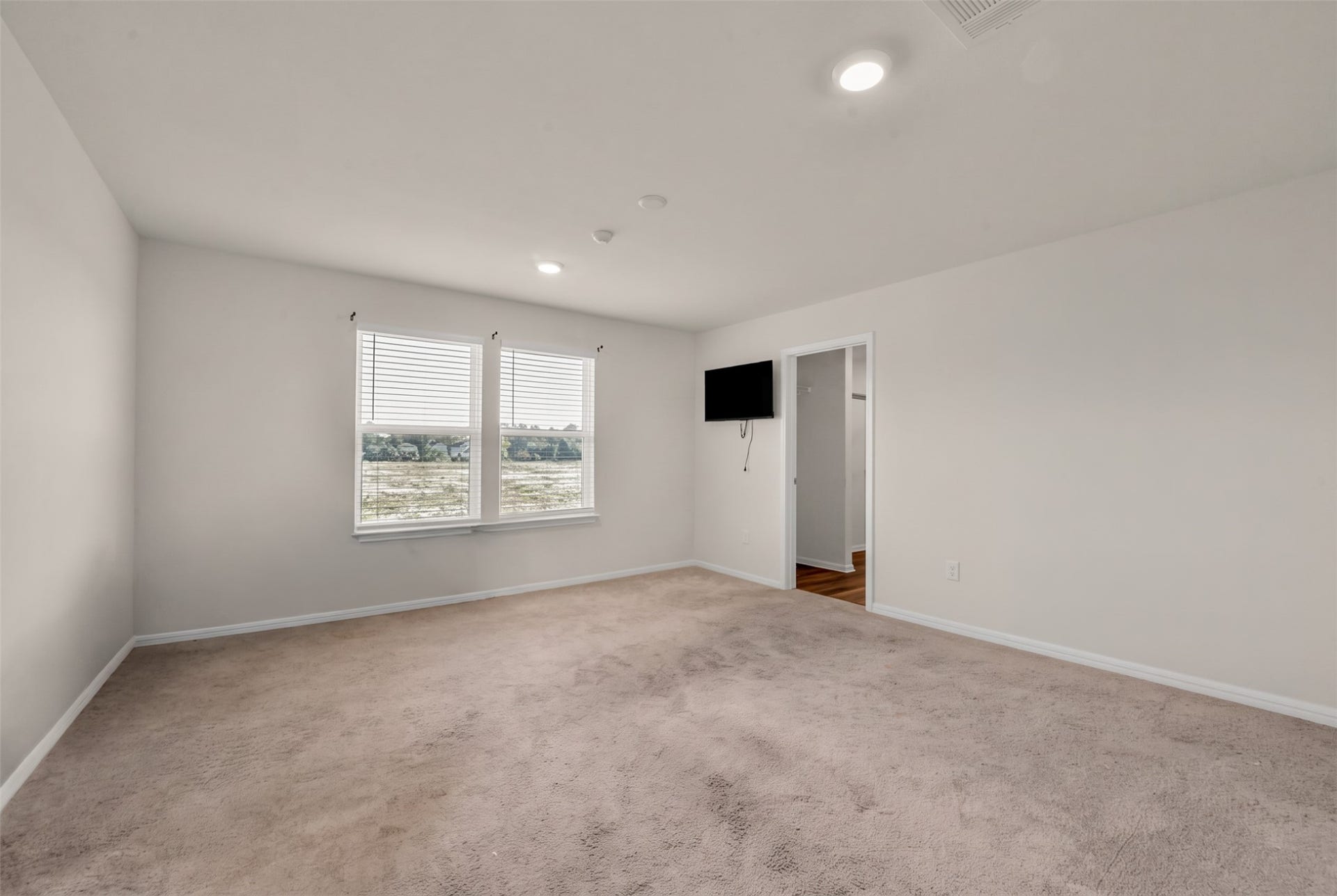 Nice size primary bedroom on the second floor, with views to an open field in the back.