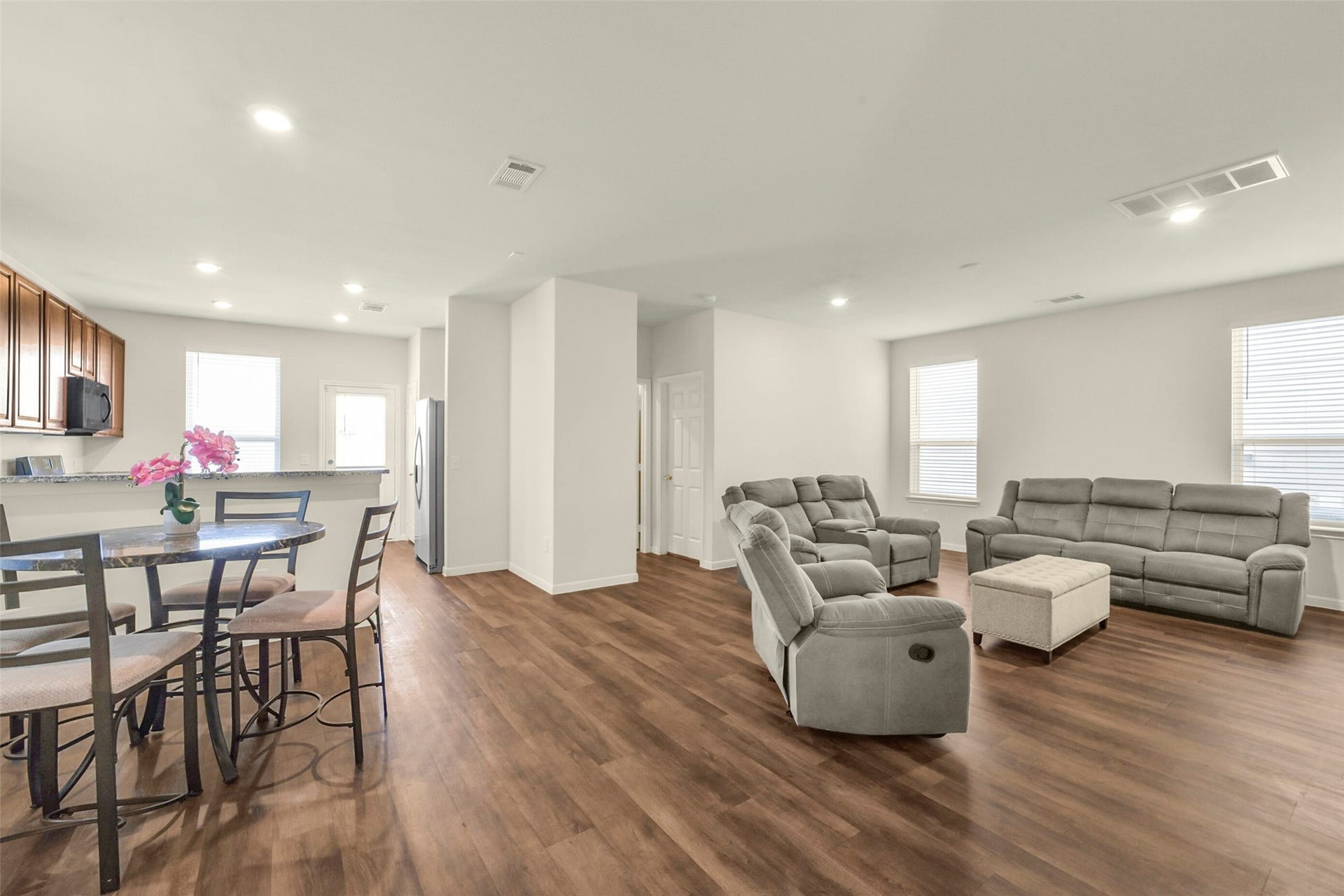 Open floor plan, with huge family room, dining area and kitchen with breakfast bar.