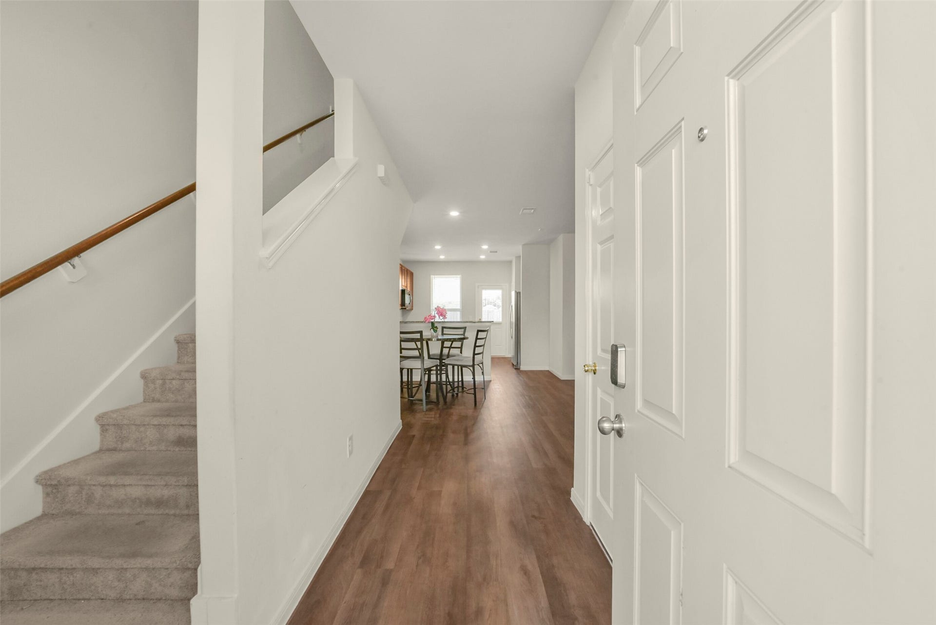 Entry leads to the open floor plan, or stairs to the second floor.