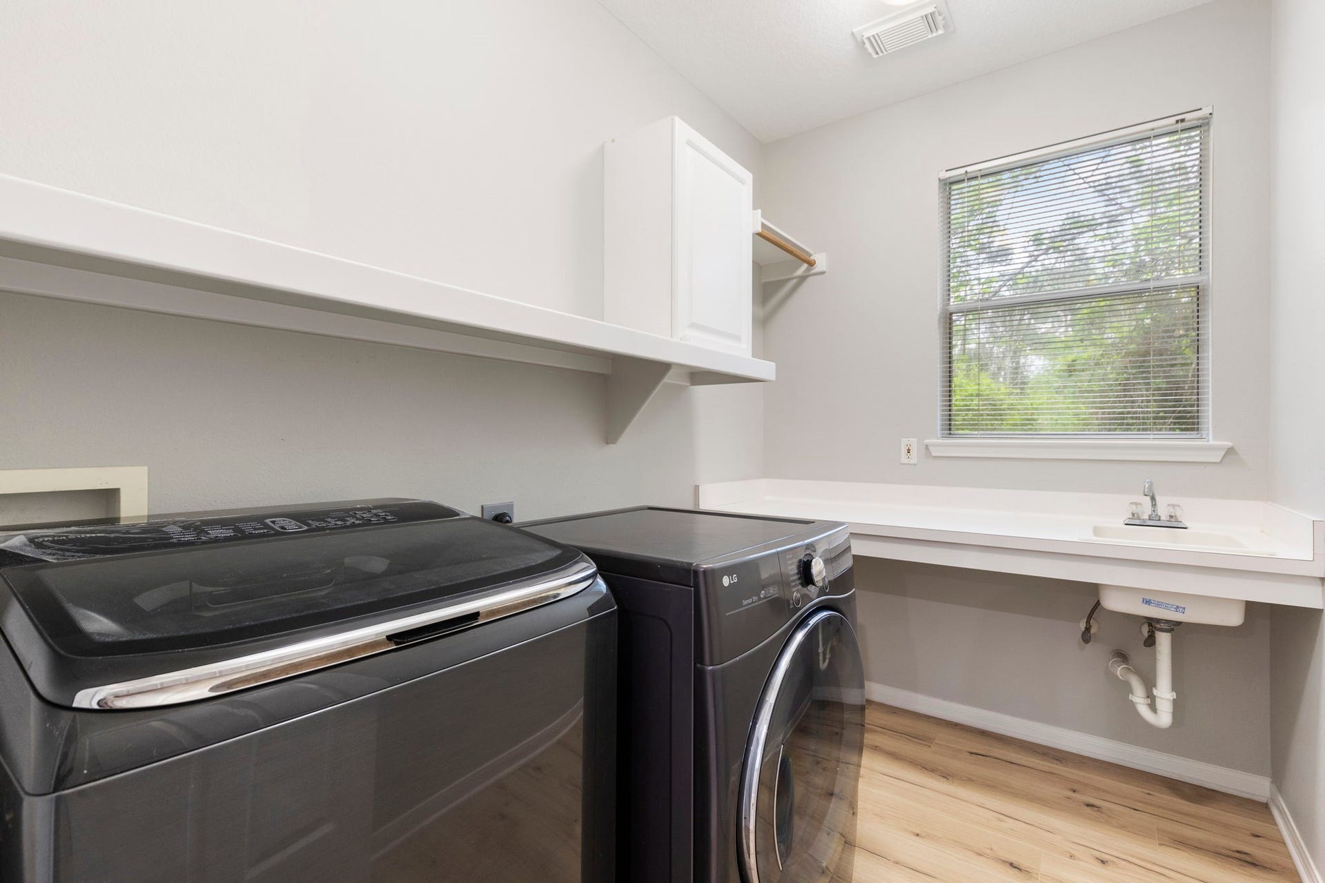 3 S Altwood Circle, The Woodlands, TX 77382 Upstairs between the two sections is the Utility Room that has a sink and storage!