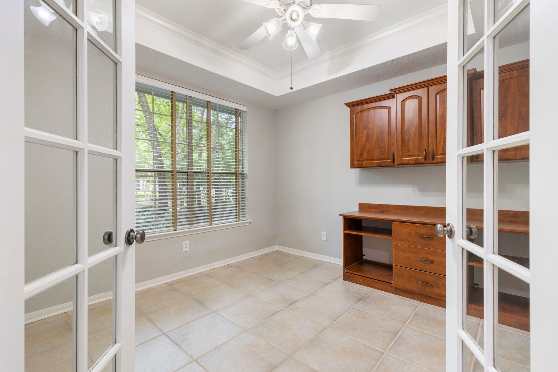 3 S Altwood Circle, The Woodlands, TX 77382 The home office has two glass French doors for added privacy.