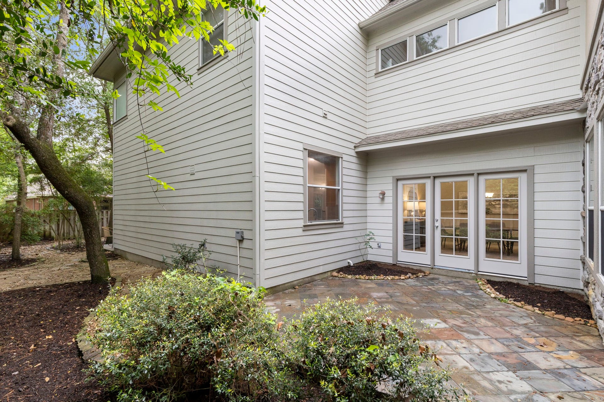 3 S Altwood Circle, The Woodlands, TX 77382 From the courtyard, you can access the backyard.