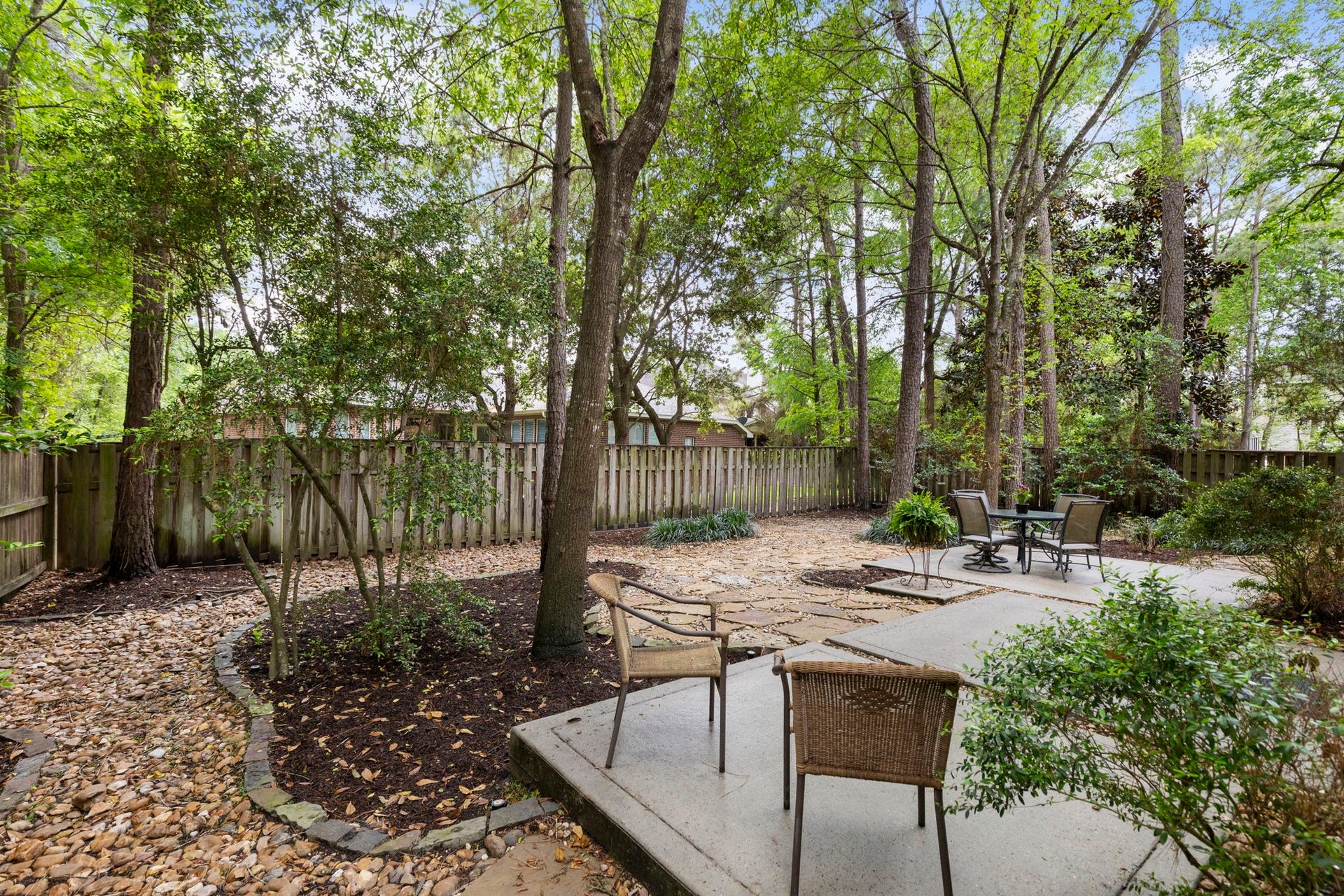 3 S Altwood Circle, The Woodlands, TX 77382 There are a few concrete pads for extra space to enjoy the back yard.
