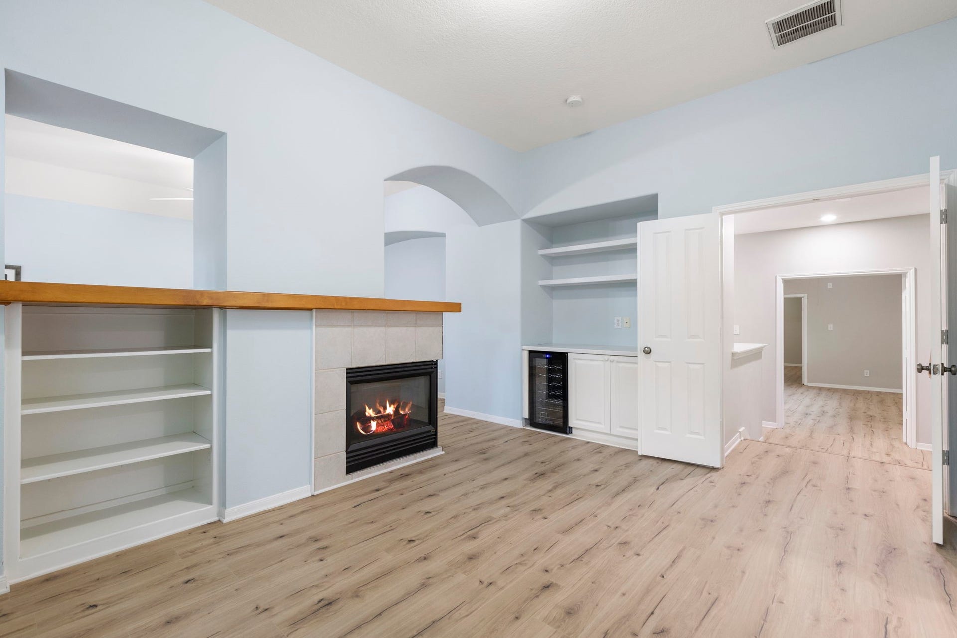 3 S Altwood Circle, The Woodlands, TX 77382 There is custom shelving and a triple sided gaslog fireplace. Oh and there is a Beverage Refrigerator so you don't have to go far! And you can easily add a coffee bar too!