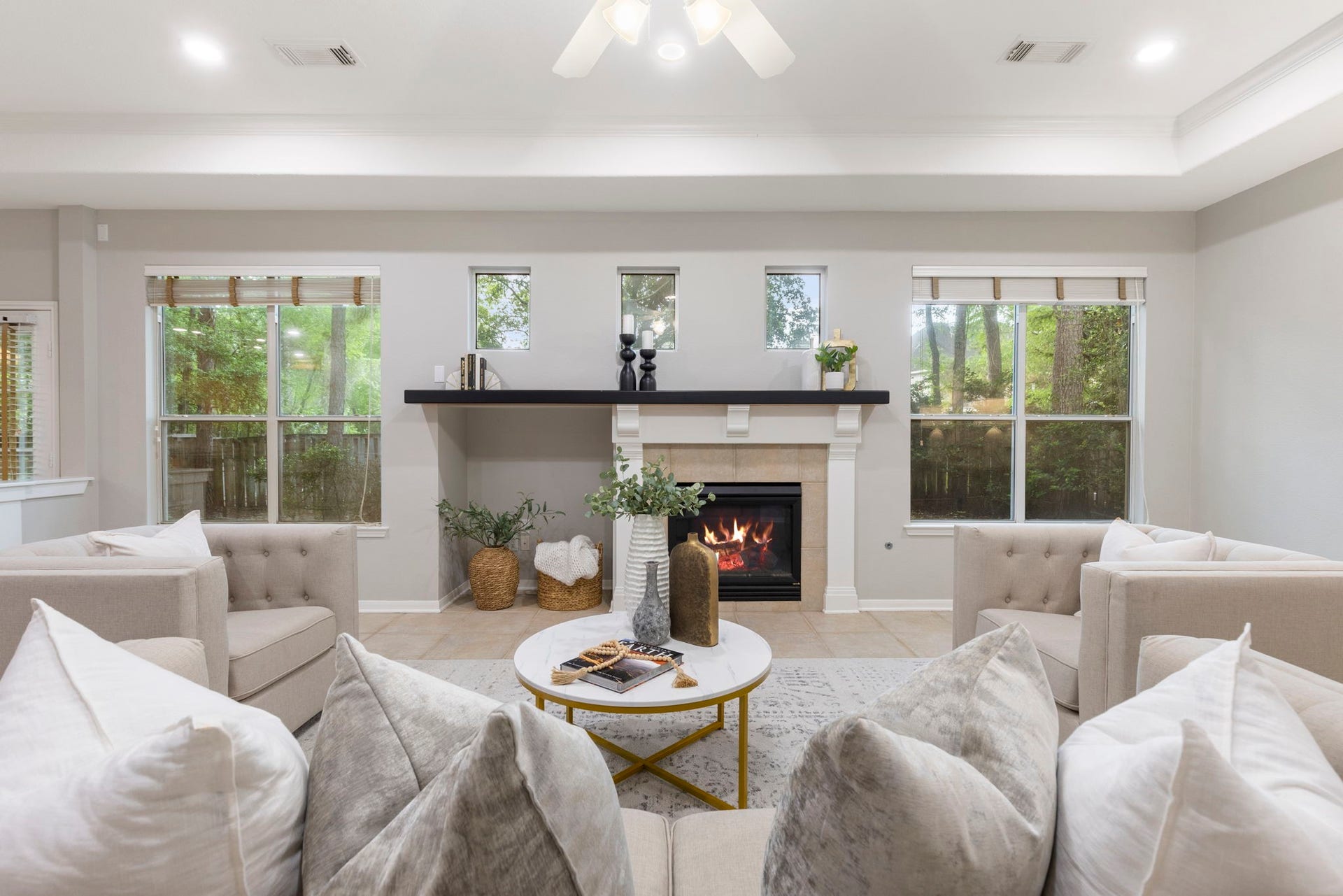 3 S Altwood Circle, The Woodlands, TX 77382 The gas log fireplace adds an extra touch to make this space cozy.