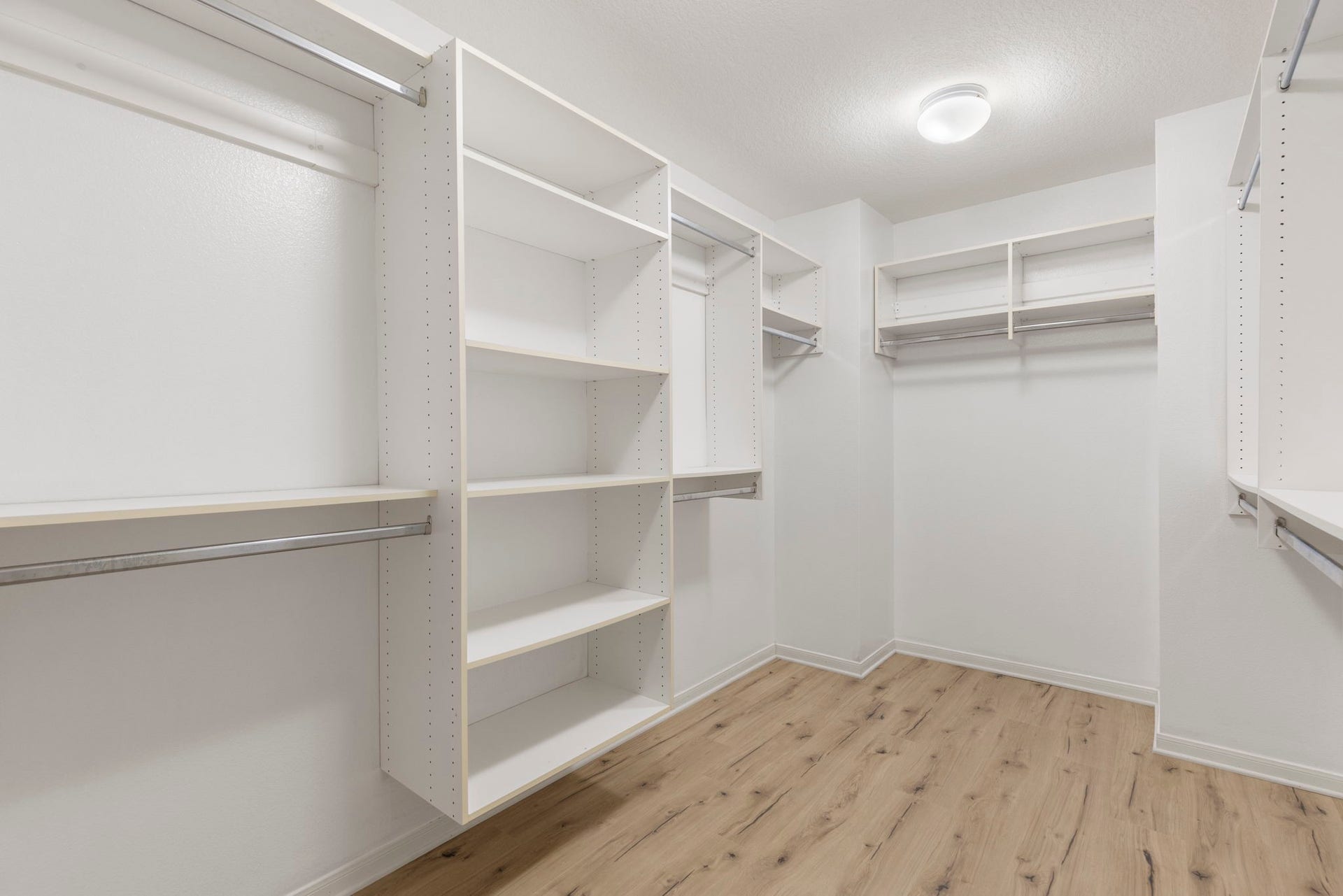 3 S Altwood Circle, The Woodlands, TX 77382 and a large walk-in closet with great shelving storage.