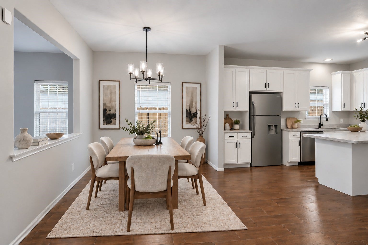 10023 Checkerberry Park Lane, Tomball, TX 77375 Virtually Staged: This open-concept dining area features a classic multi-light chandelier and a bright window that fills the space with natural light. Seamlessly connecting to both the main living room and kitchen.